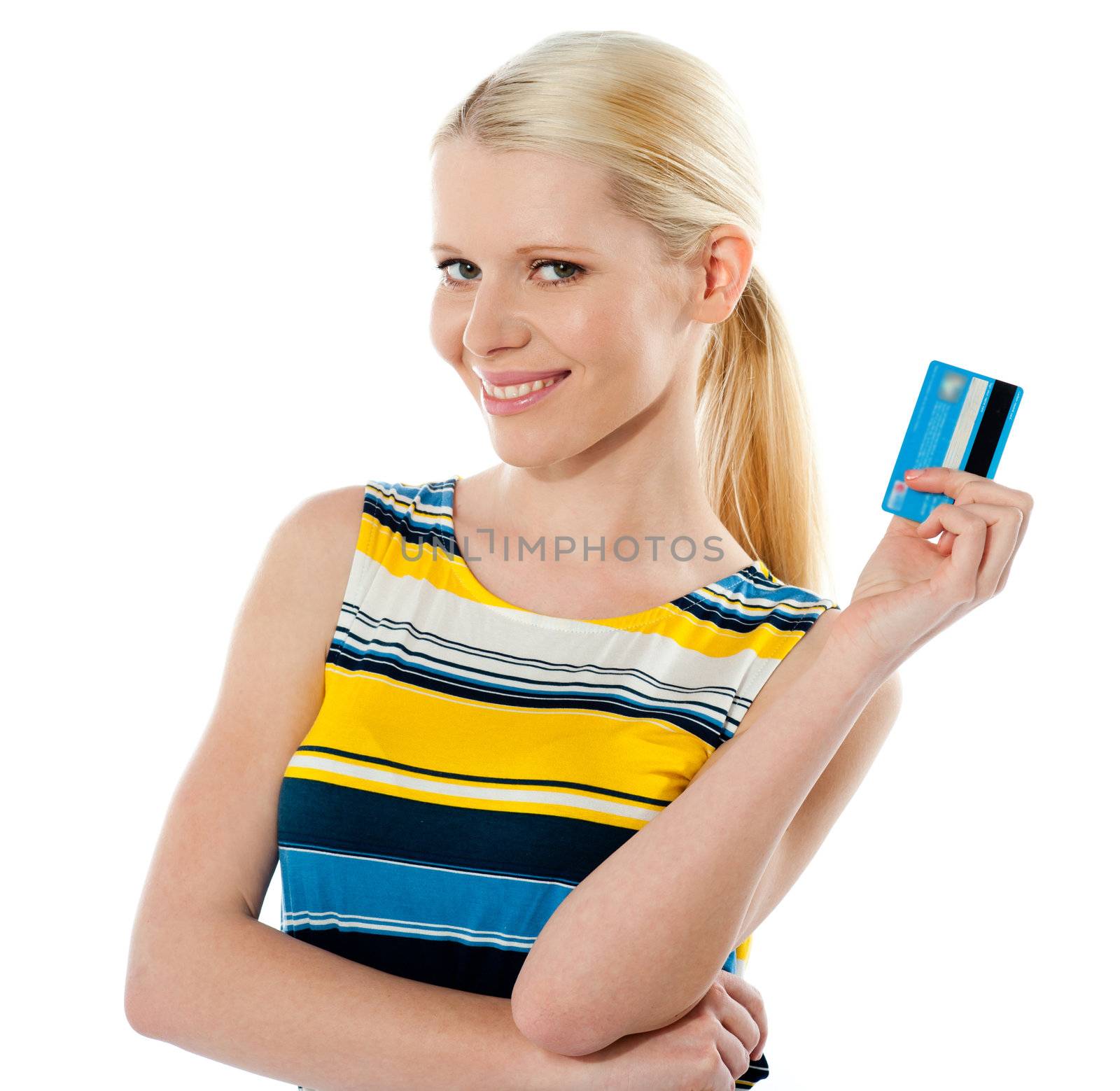 Rich american girl holding her credit card by stockyimages
