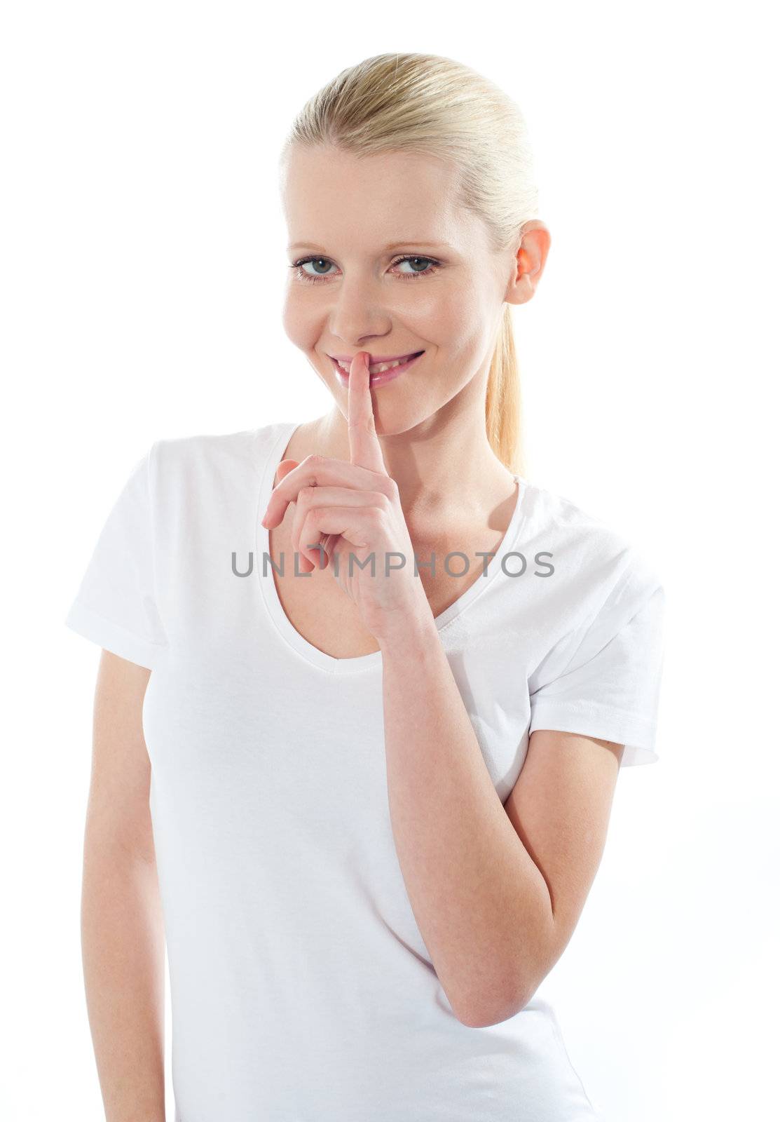 Close-up of caucasian girl with finger on her lips