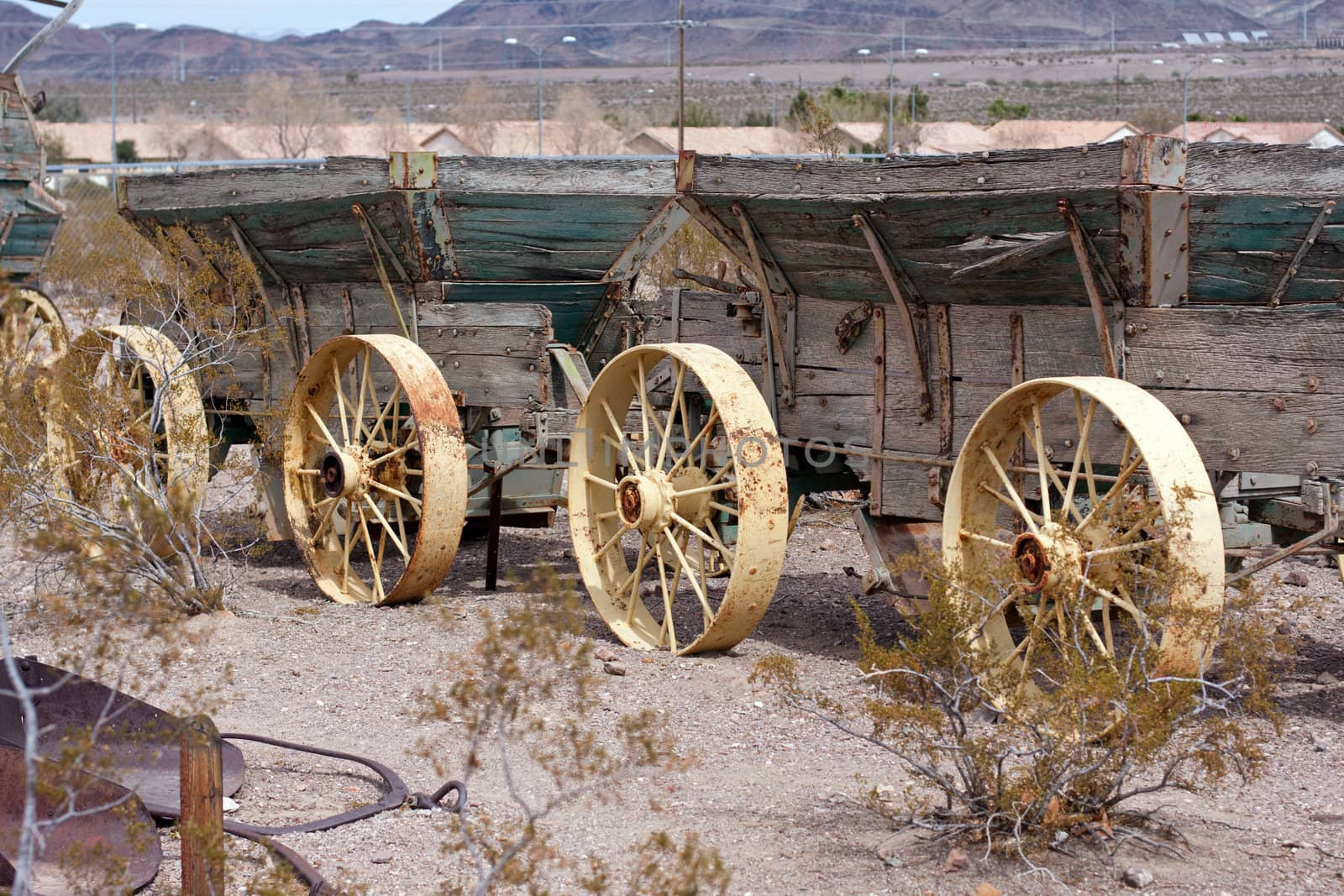 two old wild west wagons in a row with metak wheels