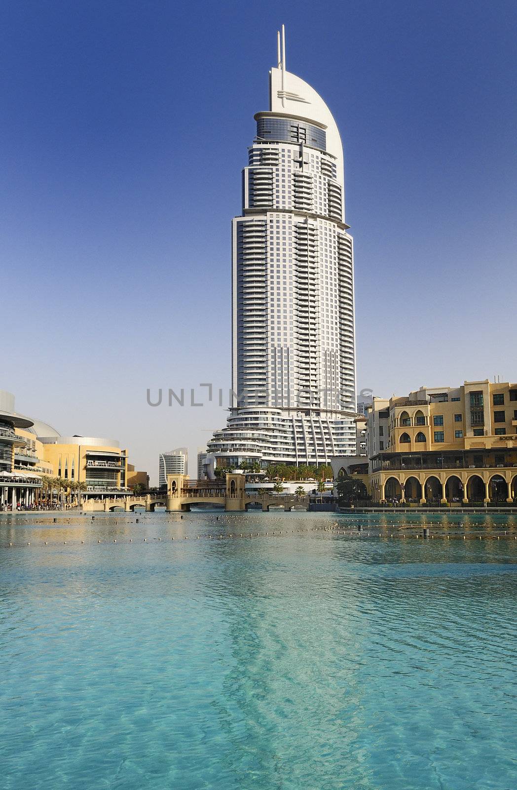 DUBAI, UAE - FEB 22: The Address Hotel in the downtown Dubai area overlooks the famous dancing fountains, taken on 22 February 2012 in Dubai. The hotel is surrounded by a mall, hotels and Burj Khalifa 