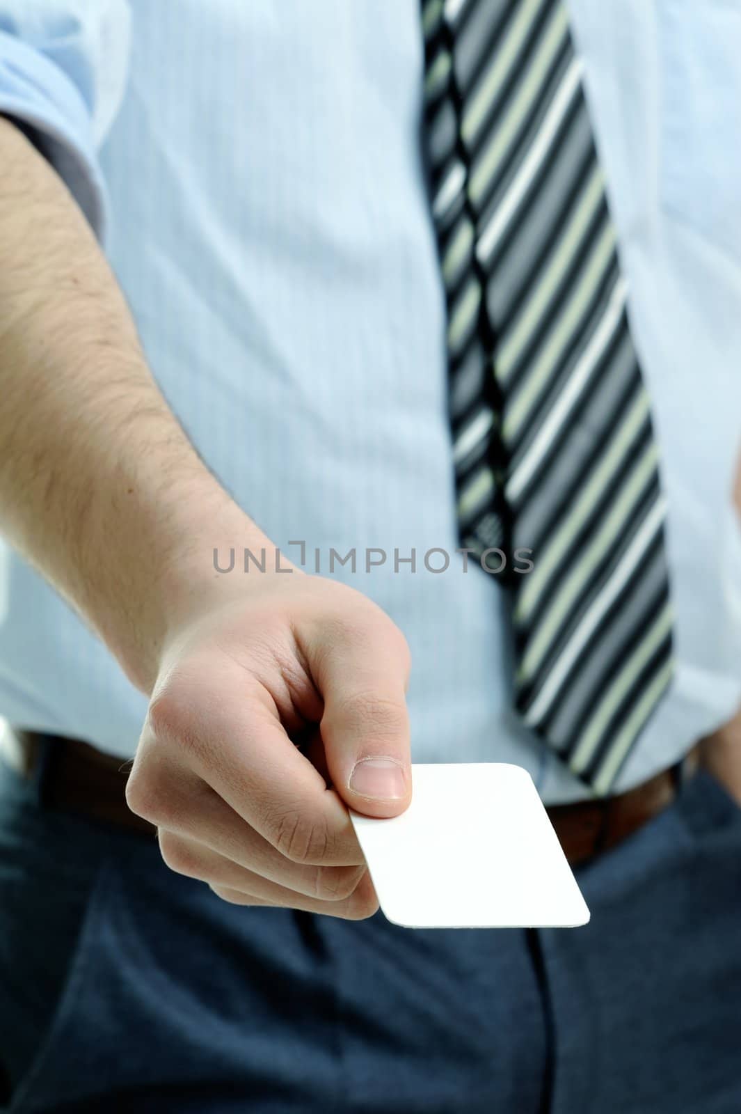 An image of businessman holding business card