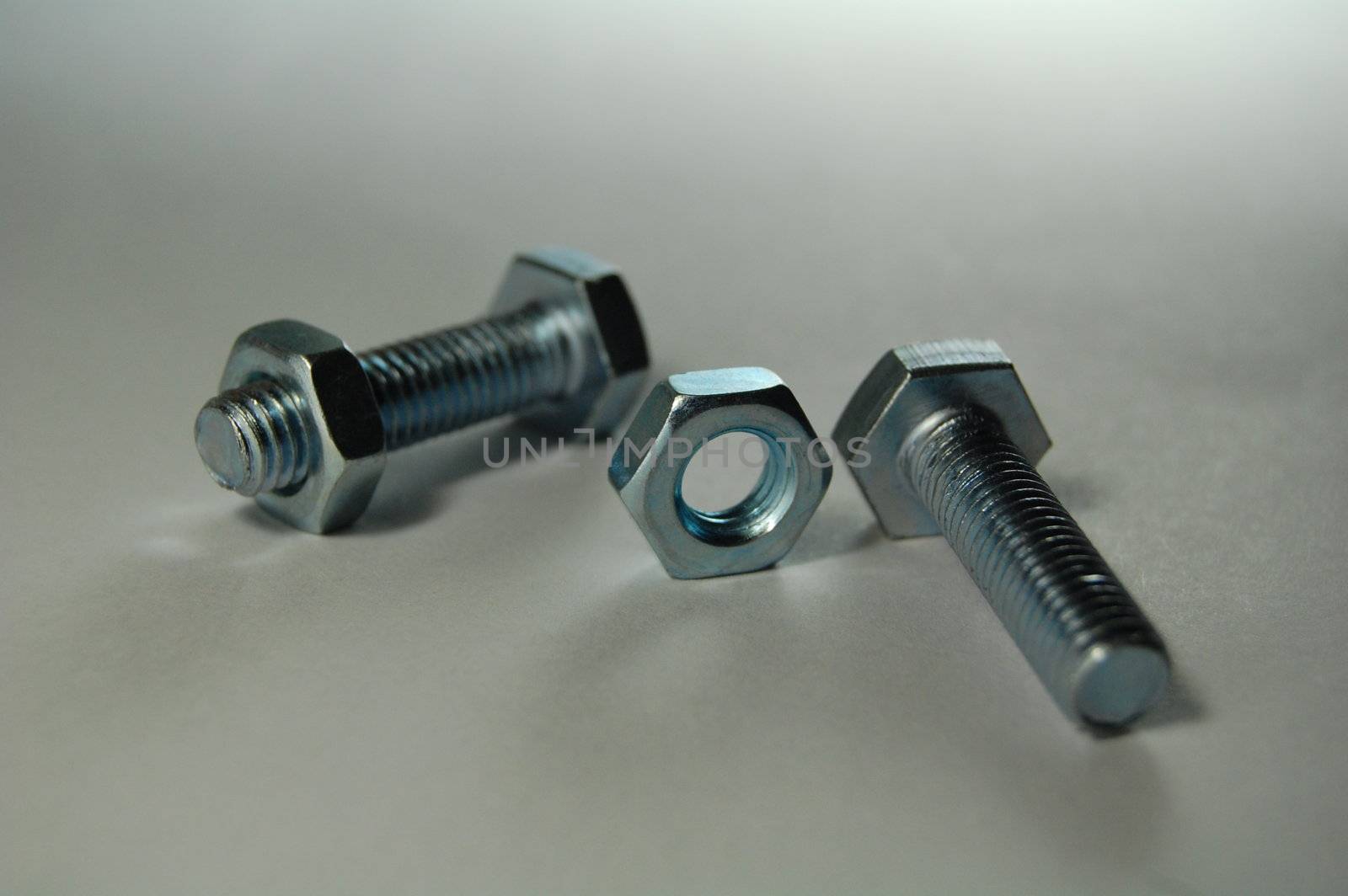 A set of shiny metal nuts and bolts for do-it-yourself  stuff or repairing/replacing old parts