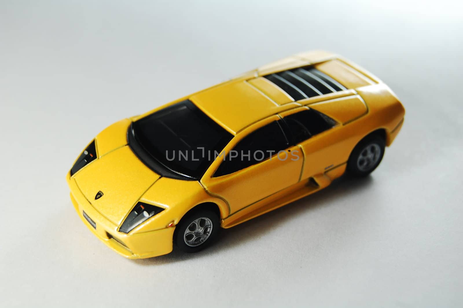 Scale model replica of lamborghini murciélago on white background