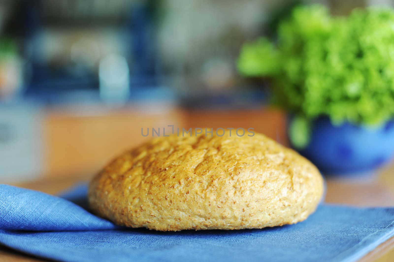 An image of a loaf of fresh bread on a napkin