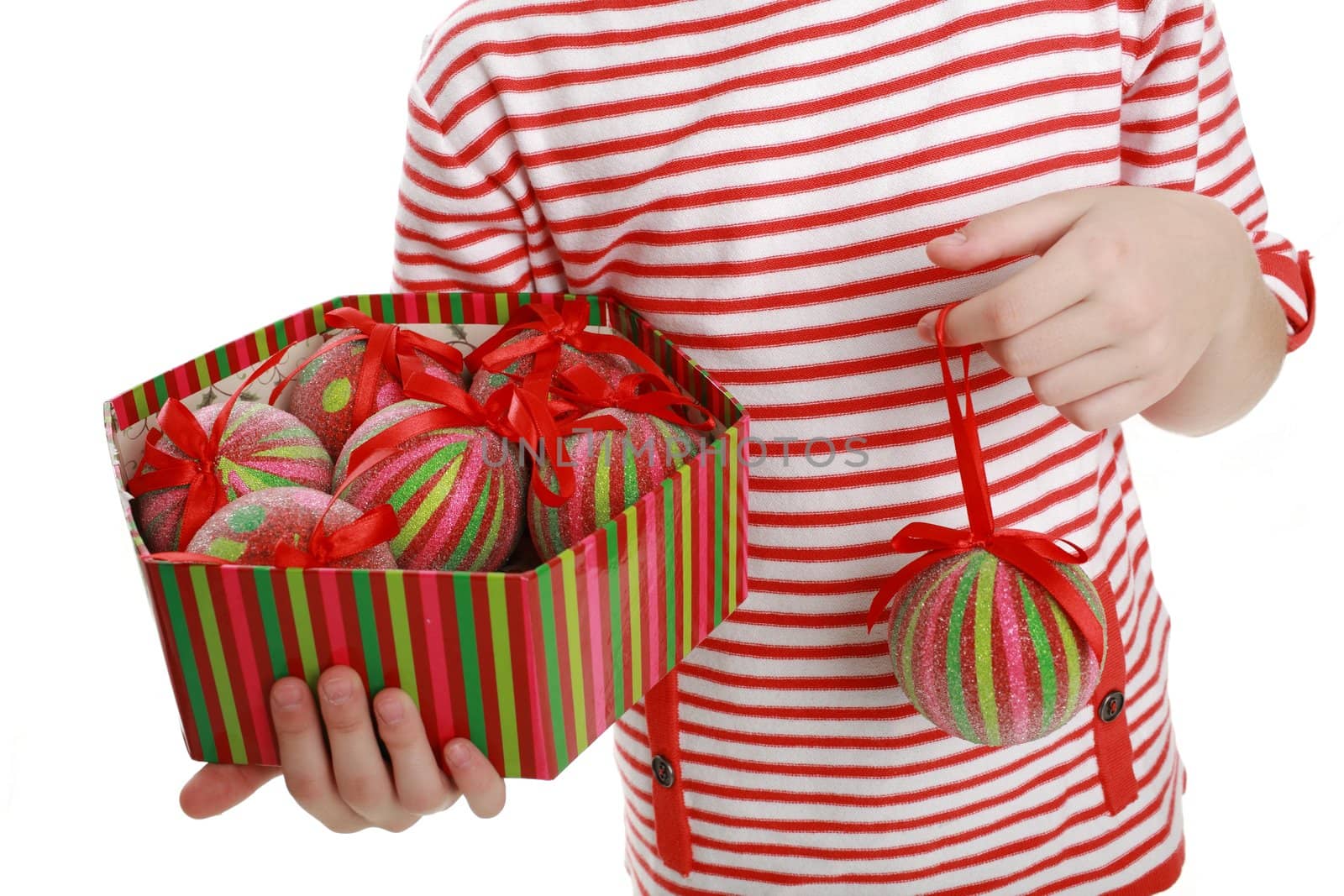 A child with a box with toys and a ball