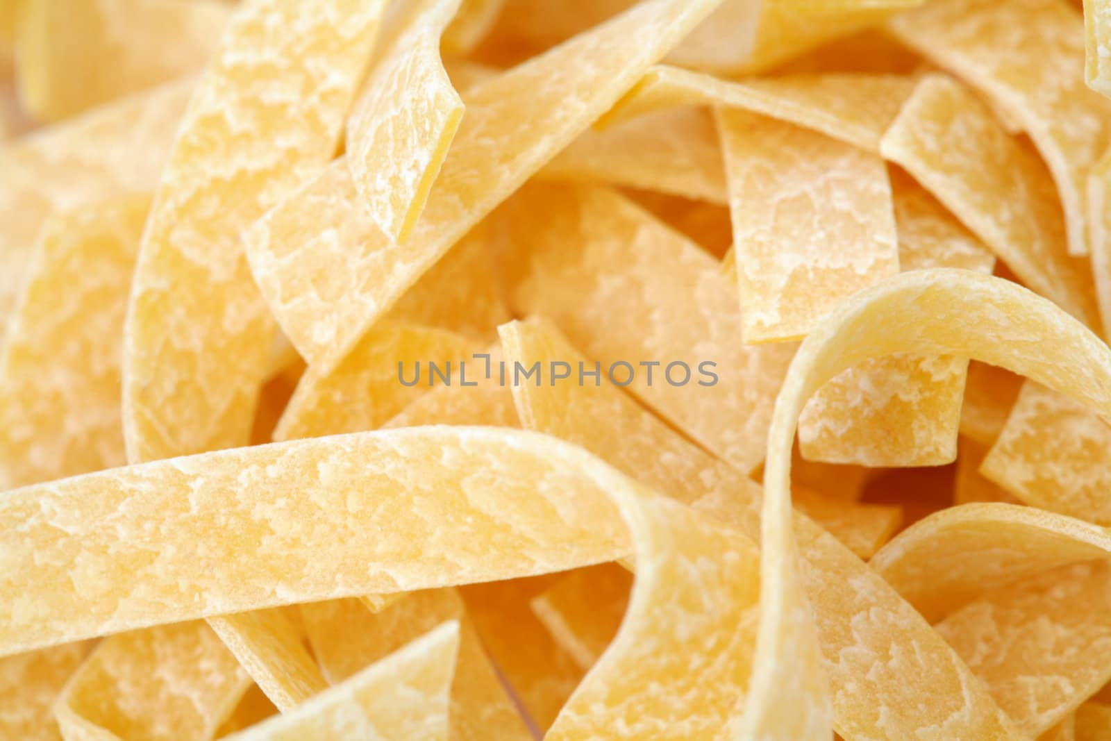 An image of yellow italic spaghetti close-up
