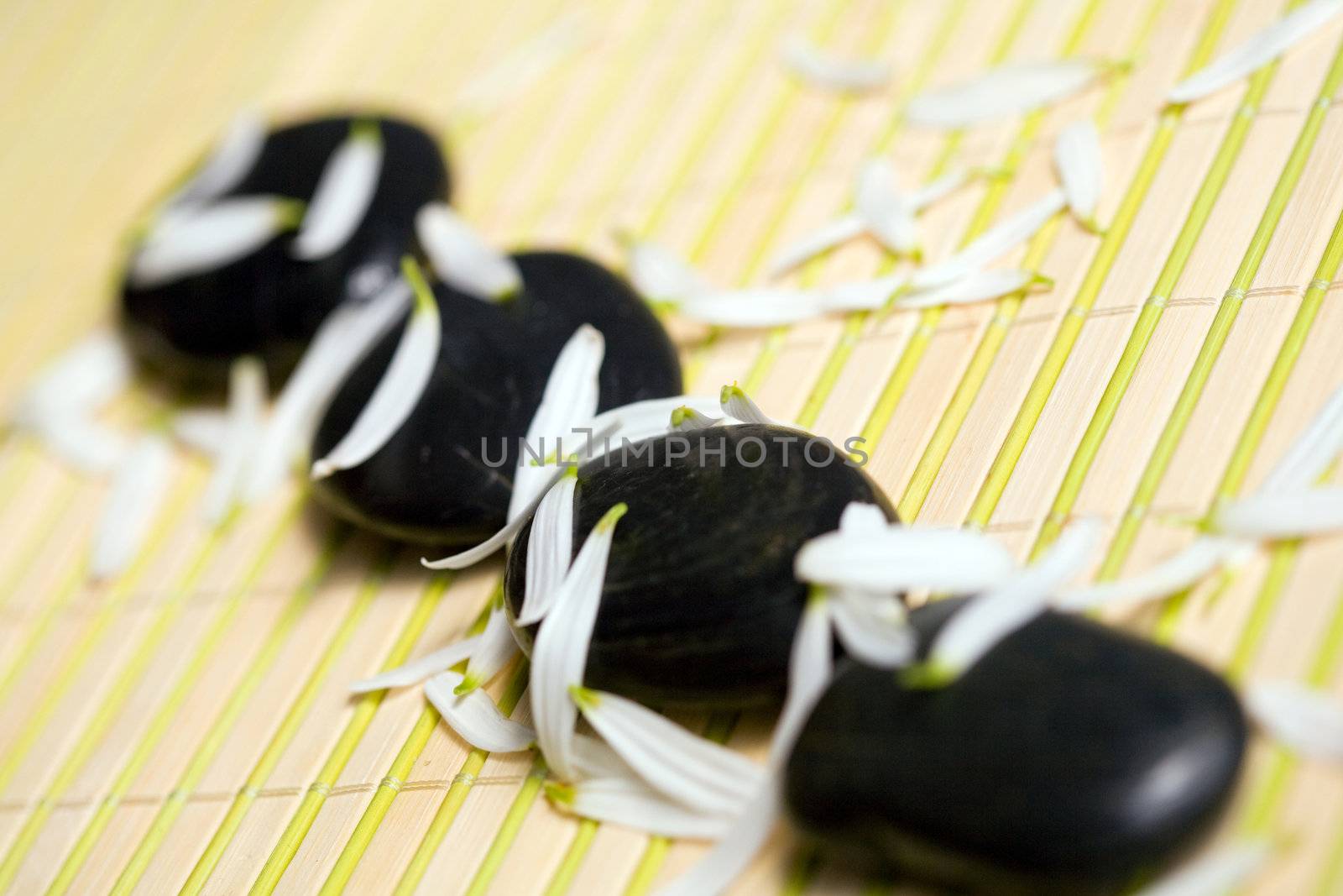 An image of black stones for spa massage