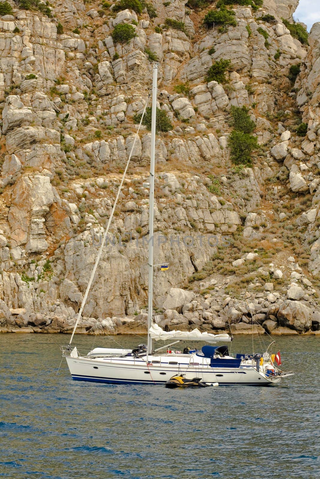 An image of white yacht in sea