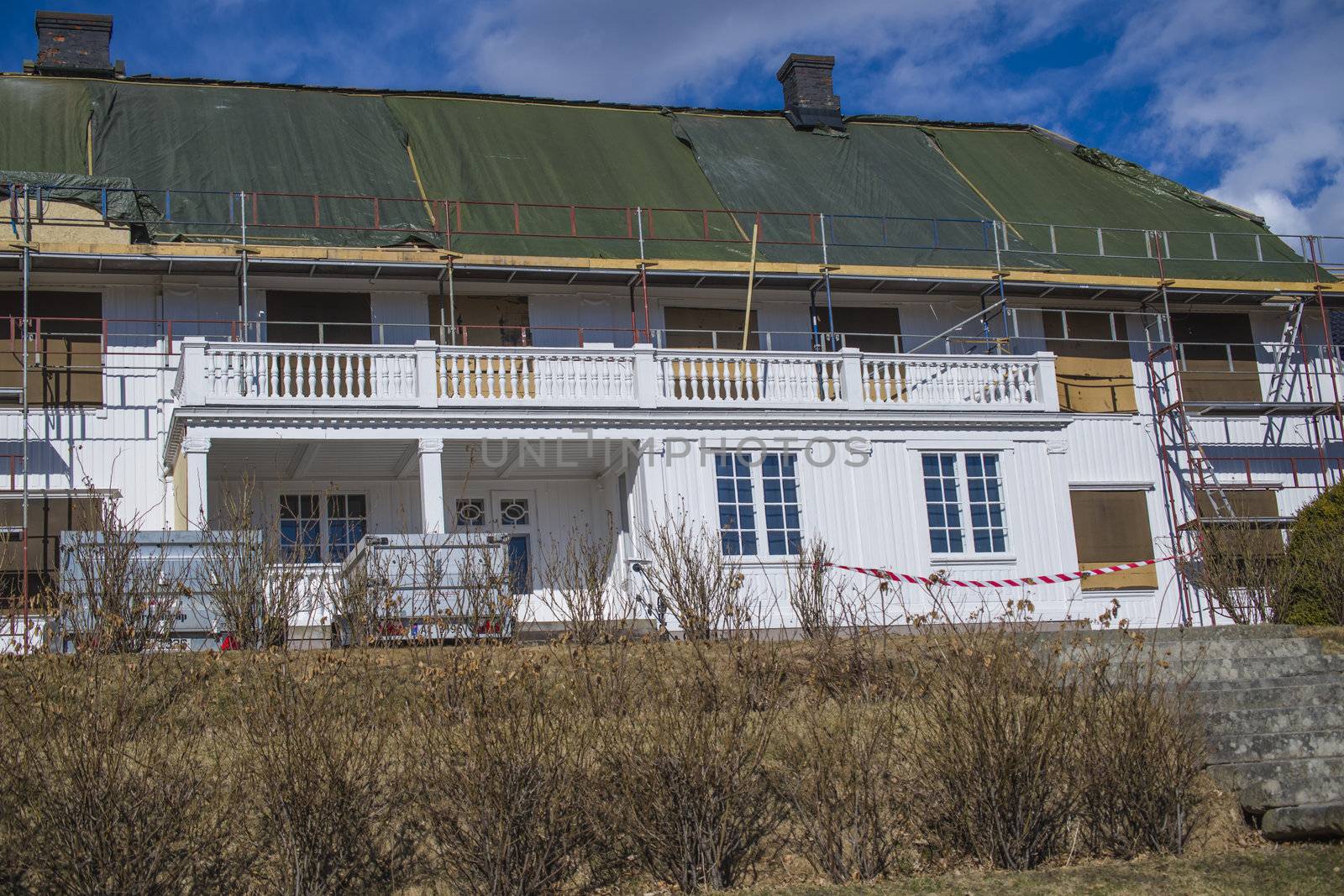 There is ongoing a major maintenance work on the Red Mansion in Halden, Norway, among other things, it added a new roof. The photo was shot one day in April 2013.