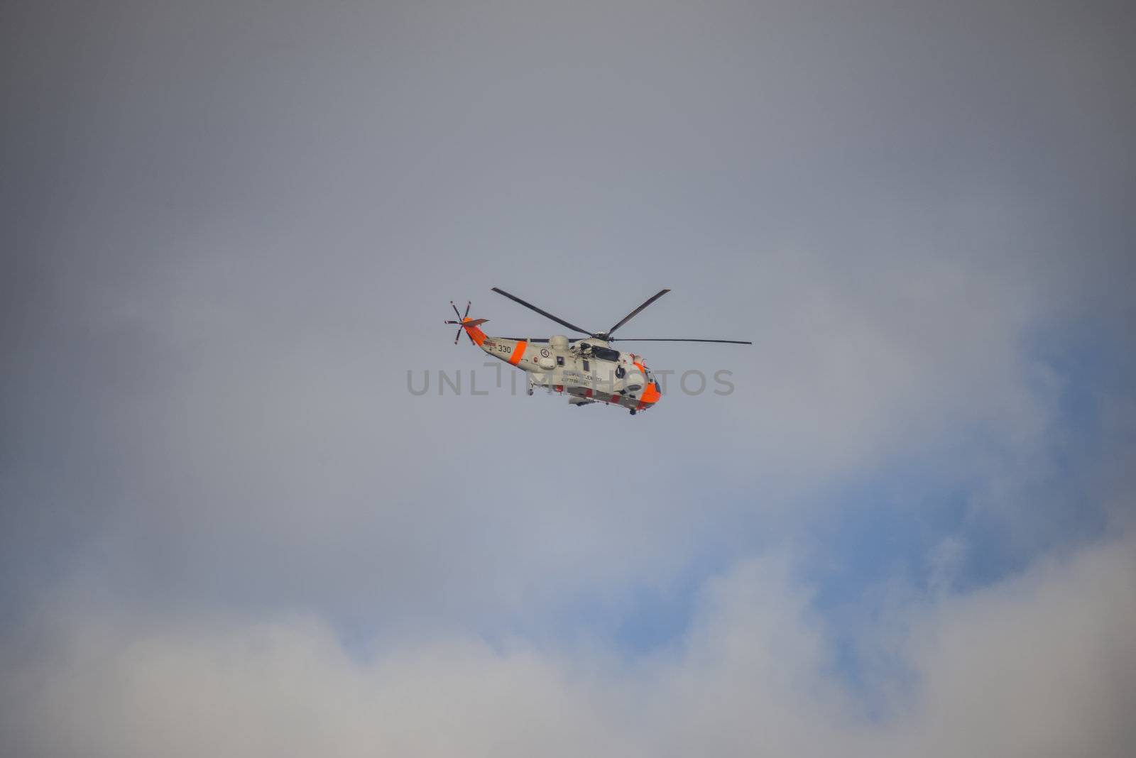 Norwegian Air Force 330 squadron, rescue service flies over Halden, Norway with a Sea King helicopter. The picture is shot one day in March 2013.