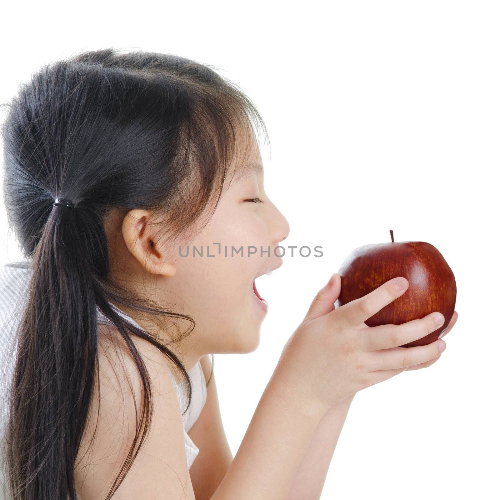 Asian girl holding an apple on white background