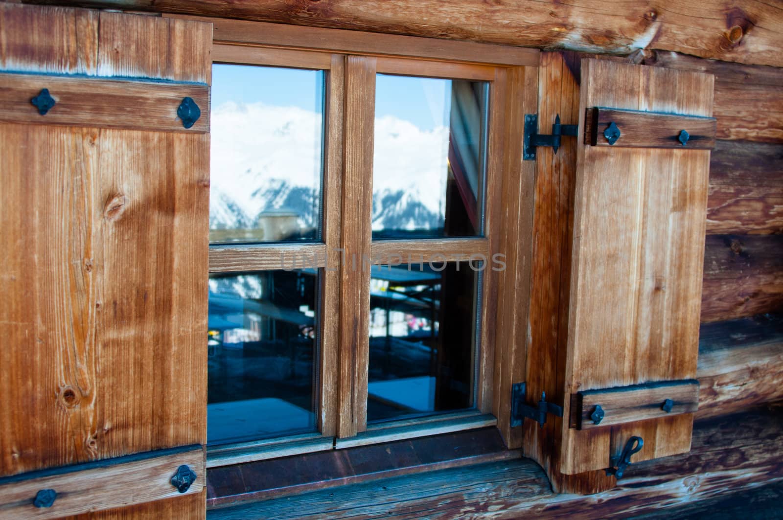 detail of alpine cottage window in snowy mountains of Montafon, Austria