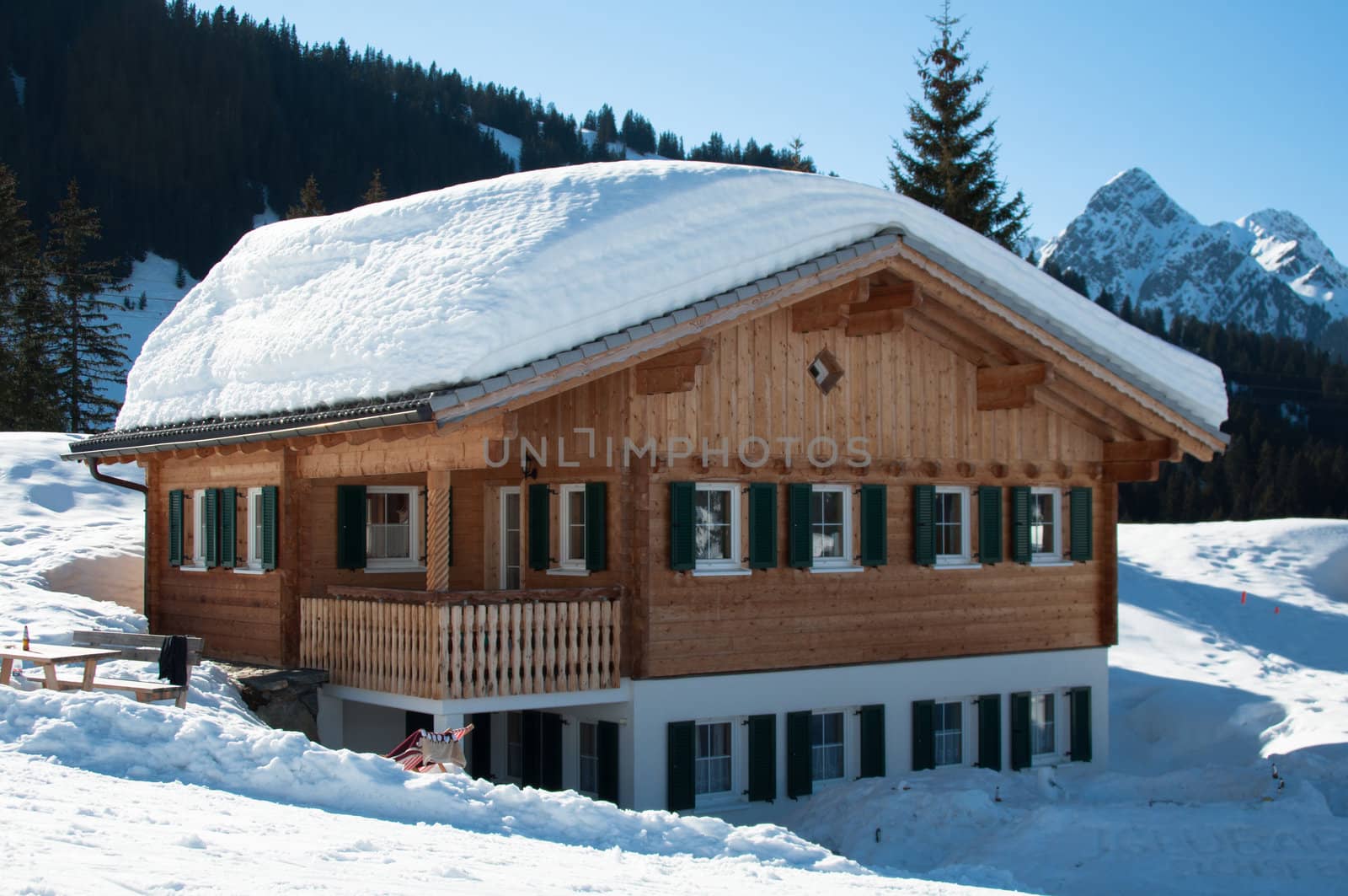 Wooden hut covered with a lot of fresh snow in Montafon, Austria