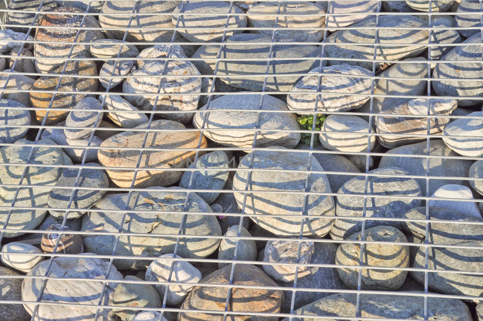 Detail of stones in a steel cage