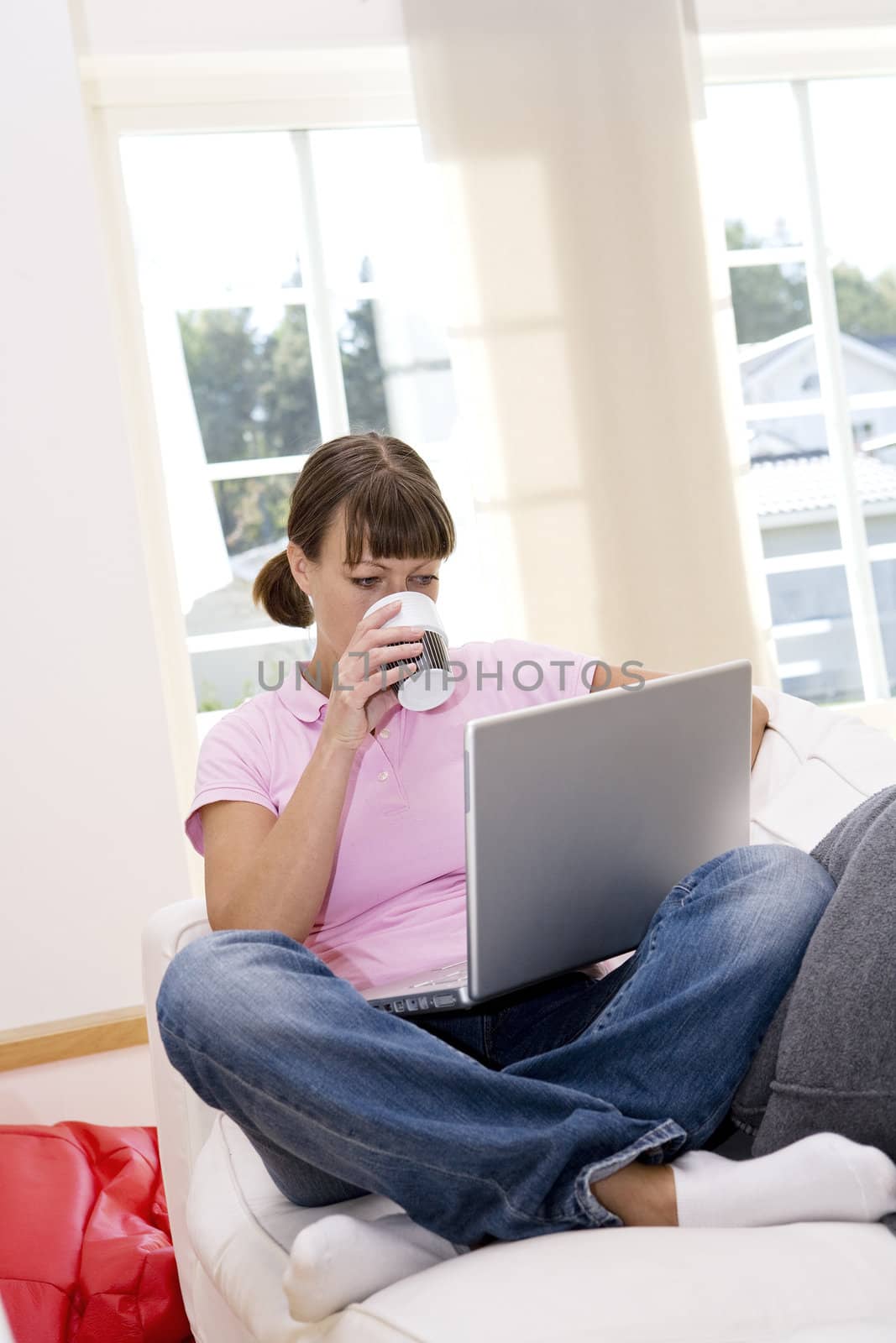 Woman with computer in the sofa