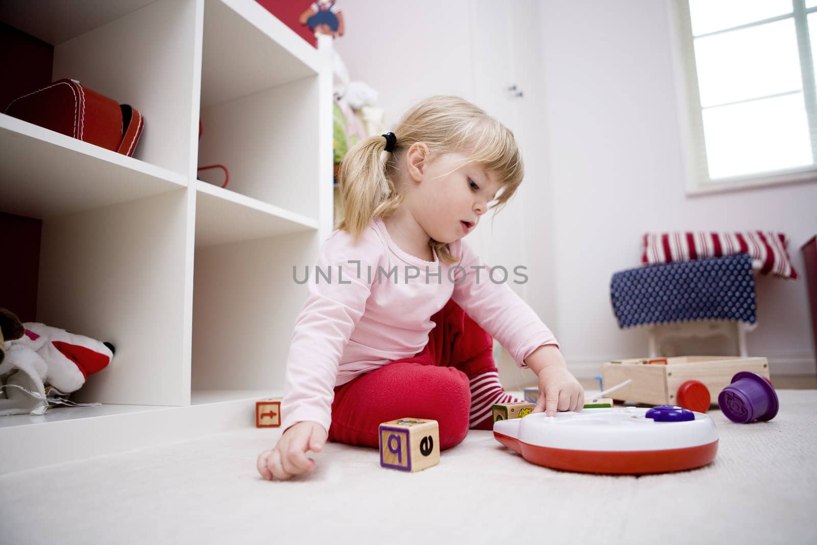 Baby girl playing in her room
