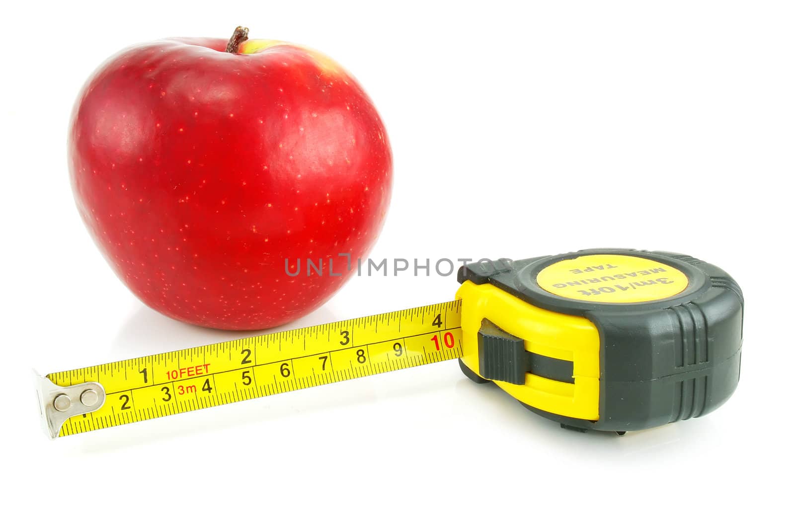 Bright red apple and measuring tape isolated on a white background