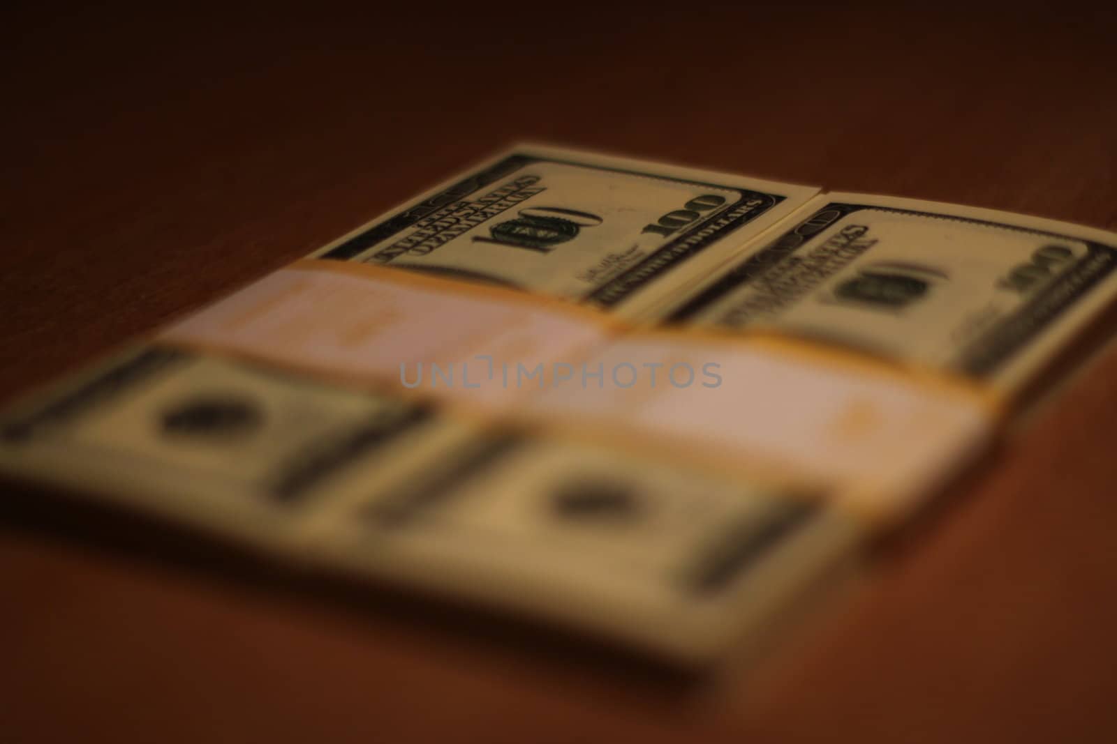 Stacks of hundred dollar bills close up.