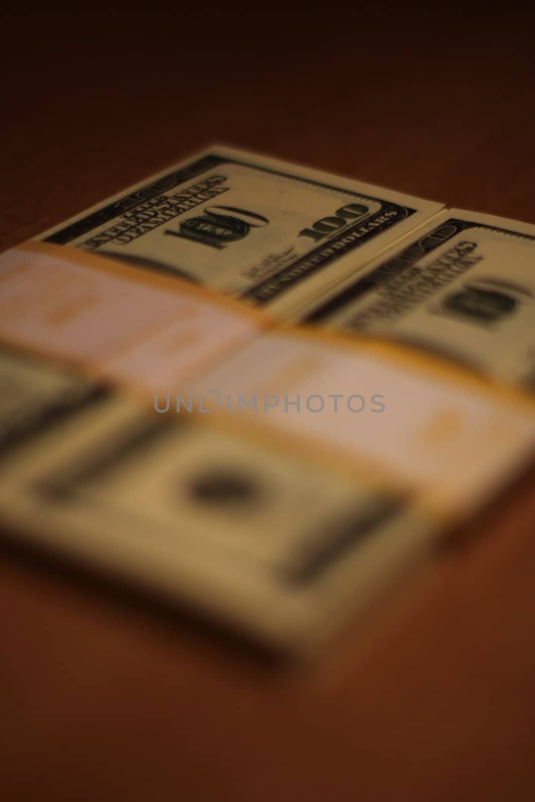 Stacks of hundred dollar bills close up.