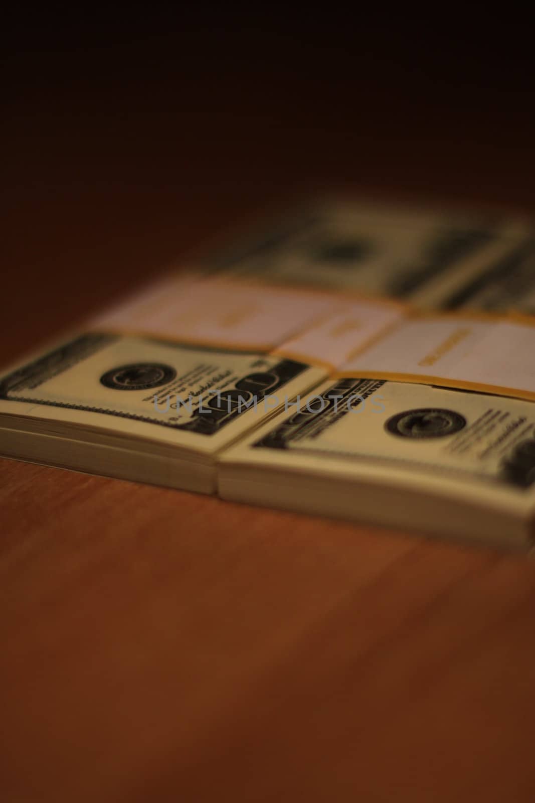 Stacks of hundred dollar bills close up.