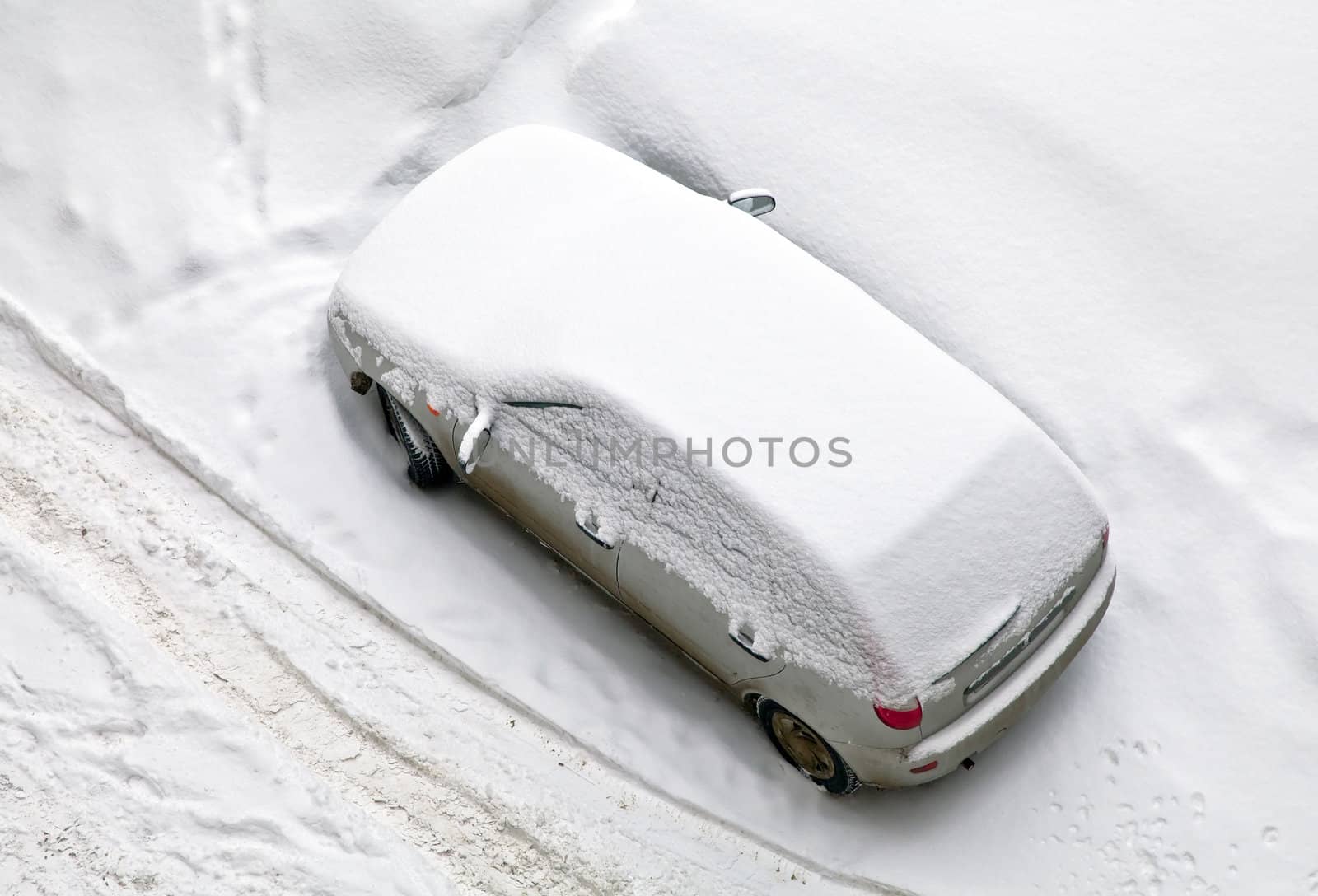 Parked car covered with snow by Oledjio