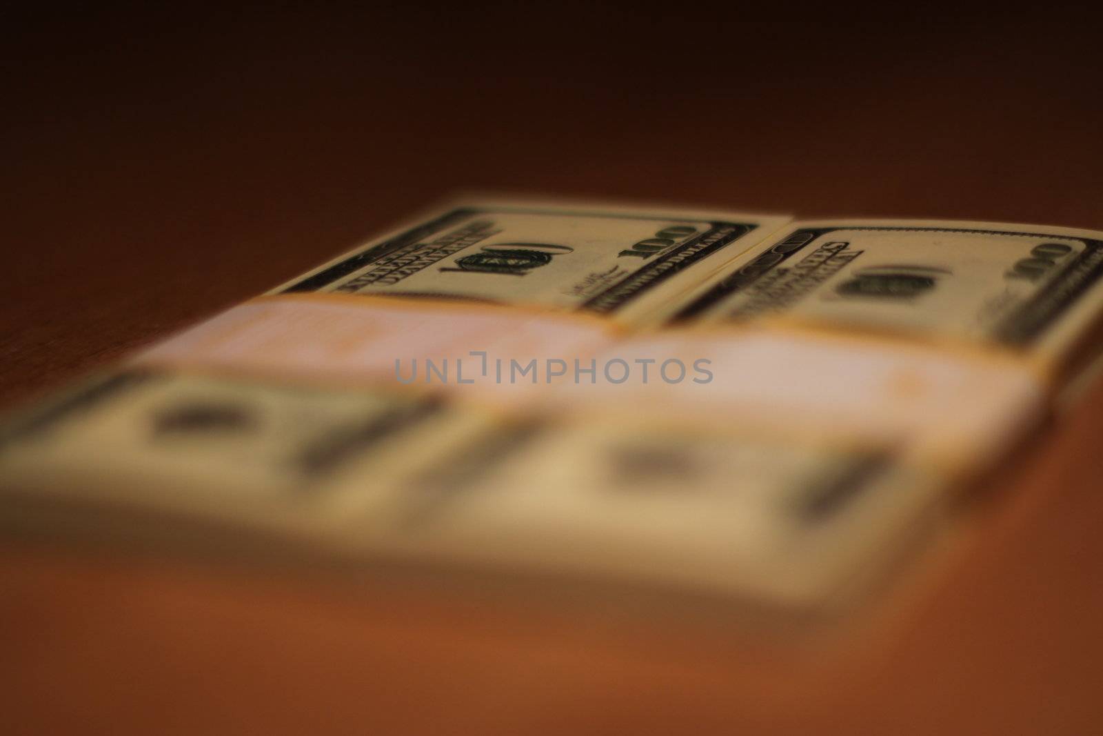 Stacks of hundred dollar bills close up.