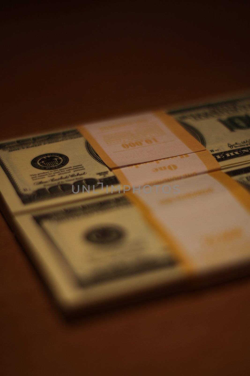 Stacks of hundred dollar bills close up.