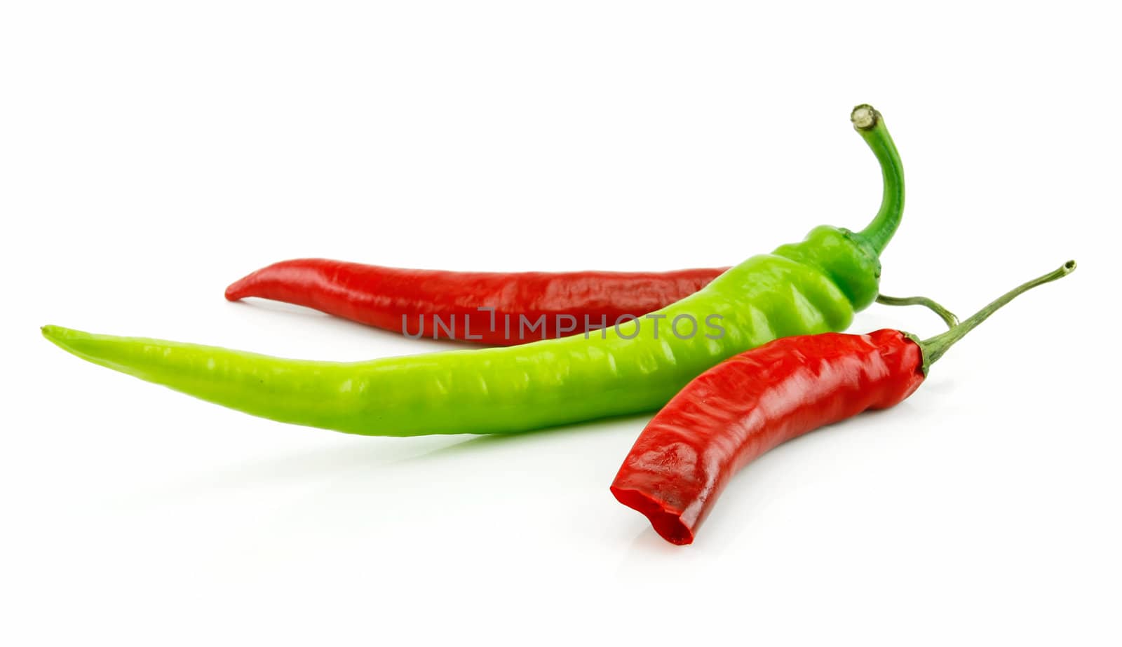 Green and Red Chili Peppers Isolated on White by alphacell