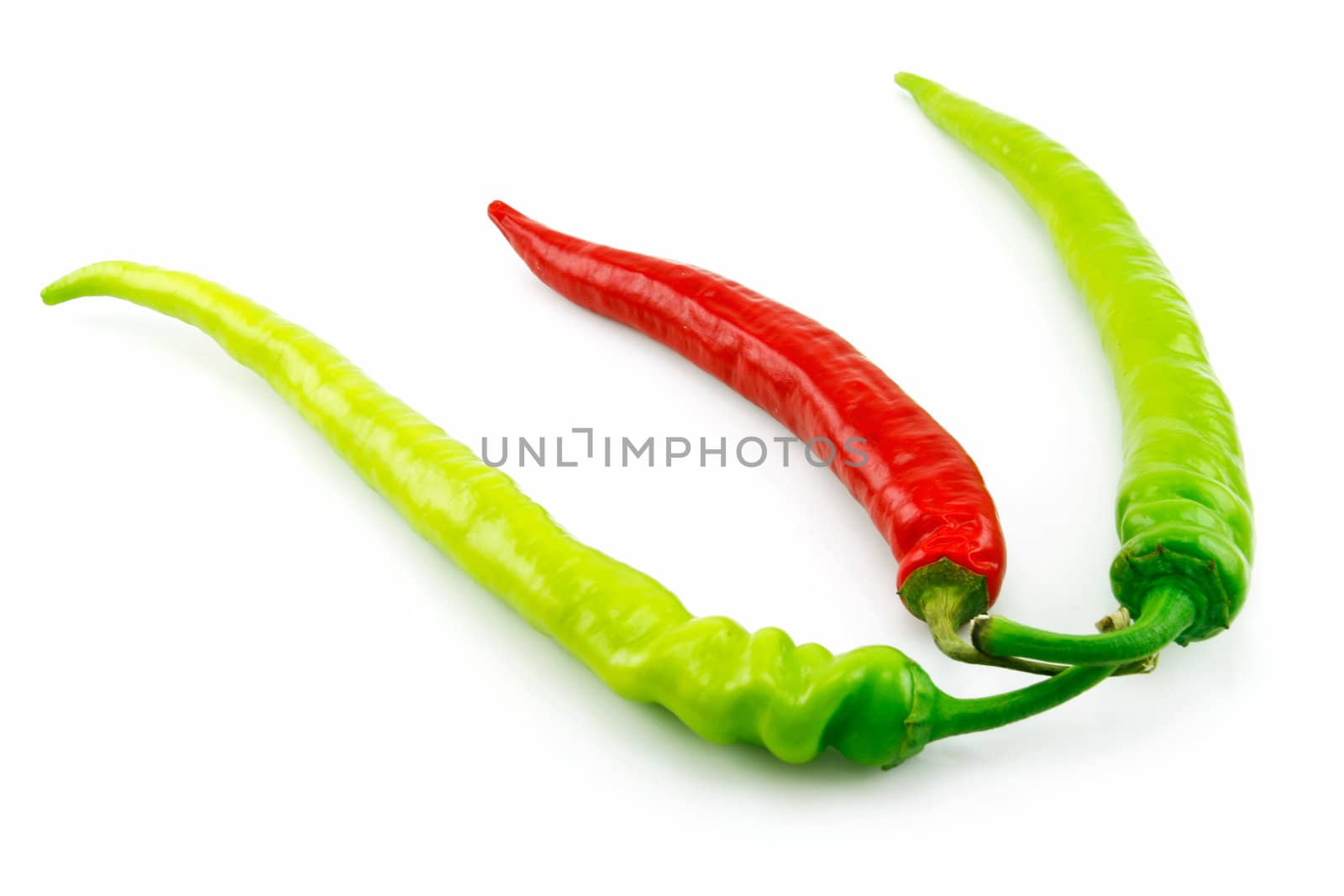 Green and Red Chili Peppers Isolated on White by alphacell