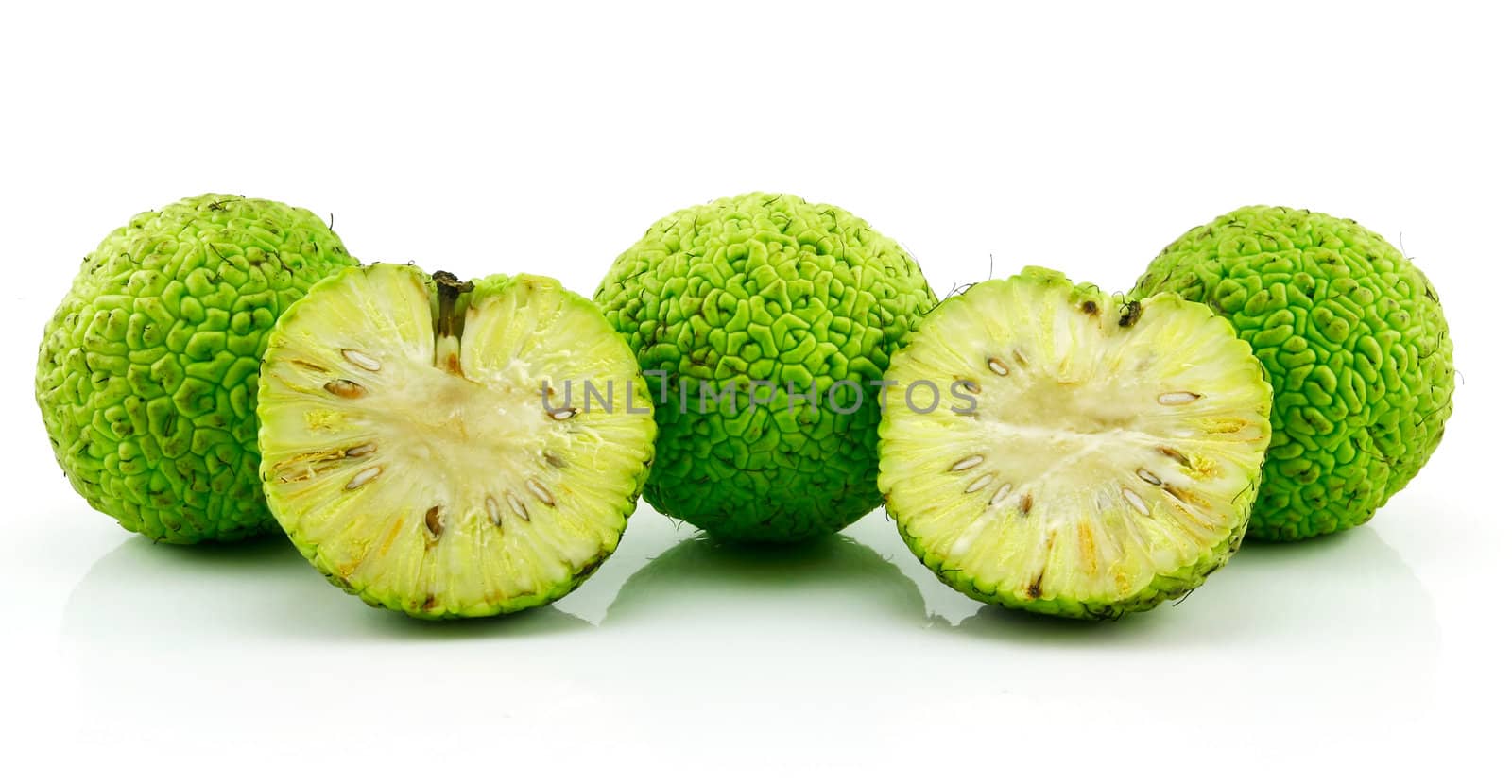 Sliced Osage Oranges (Maclura) Isolated on White by alphacell
