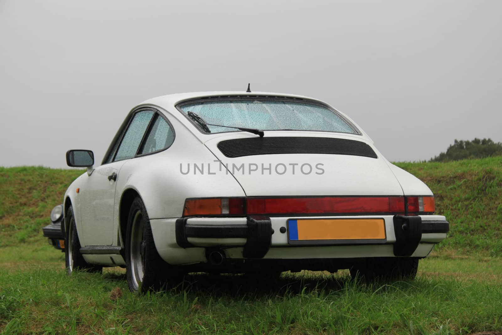 Classic white sportscar on the grass, German brand