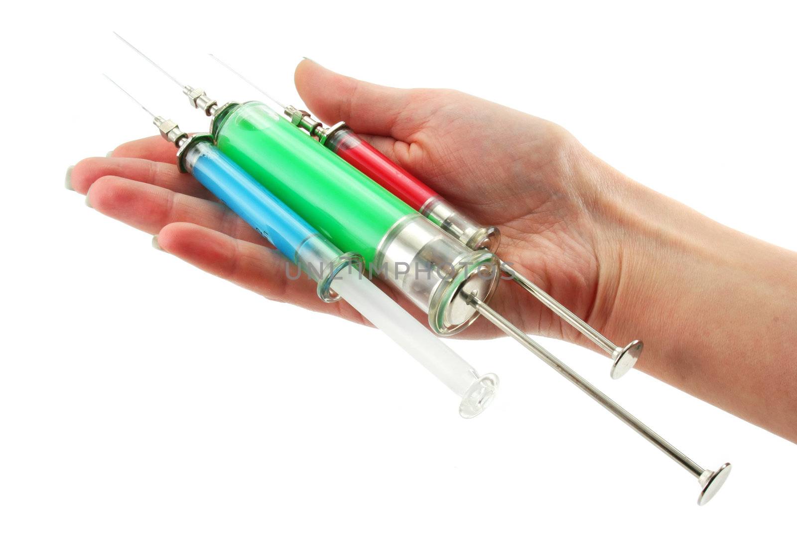 Three reusable syringes with acid substance in hands isolated on a white background