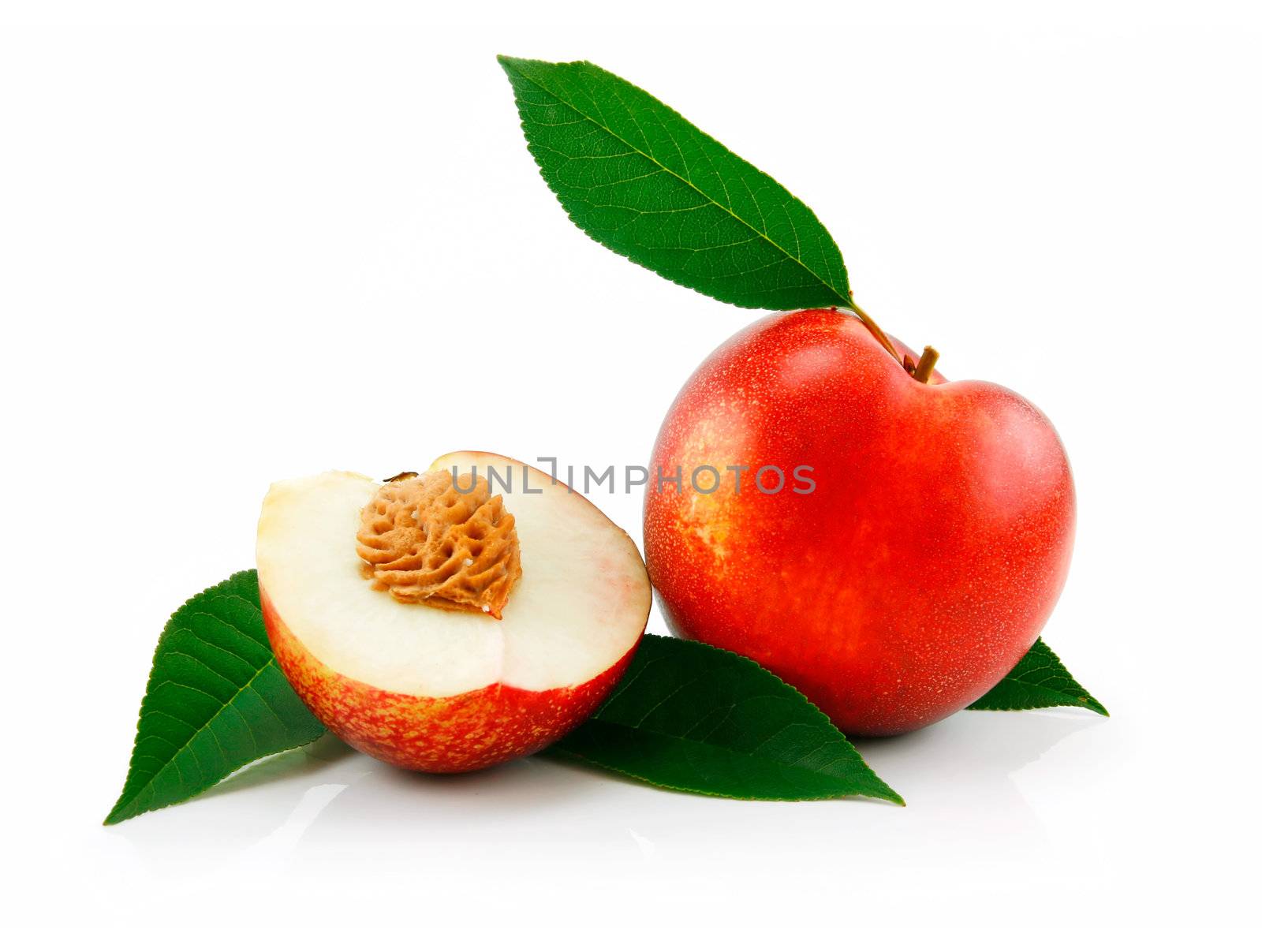Ripe Sliced Peach (Nectarine) with Green Leafs Isolated on White Background