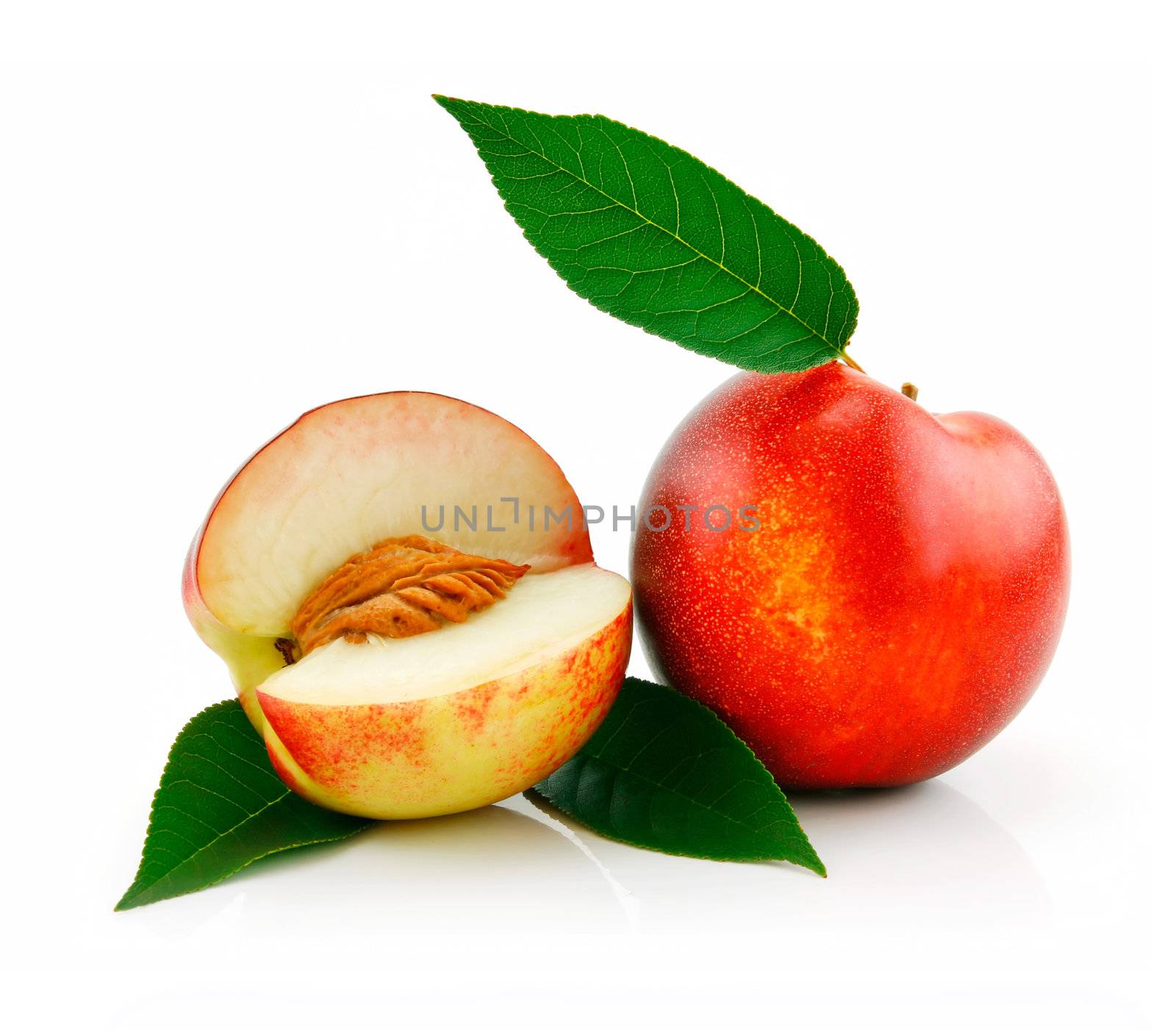 Ripe Sliced Peach (Nectarine) with Green Leafs Isolated on White Background