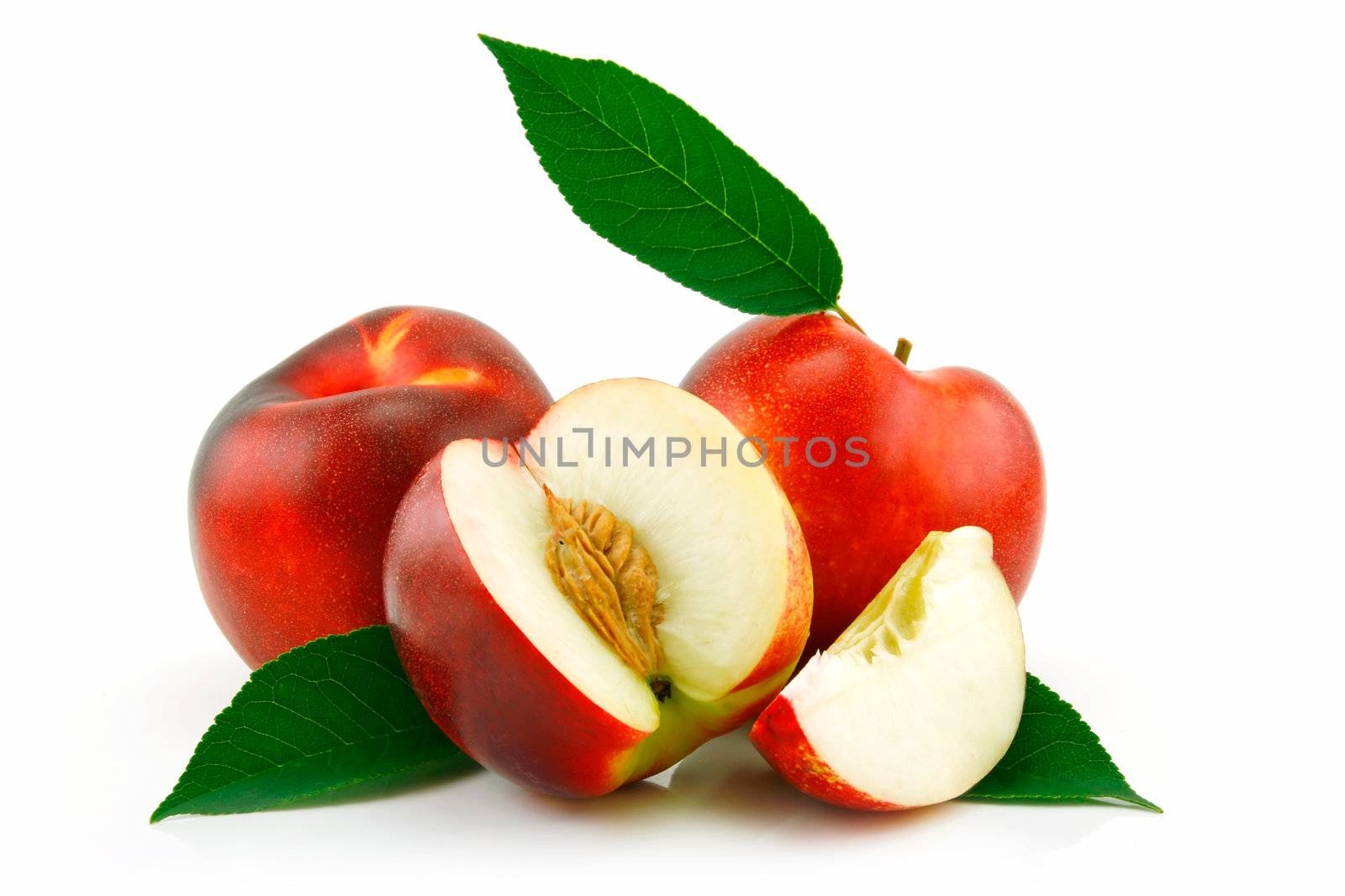 Ripe Sliced Peach (Nectarine) with Green Leafs Isolated on White Background