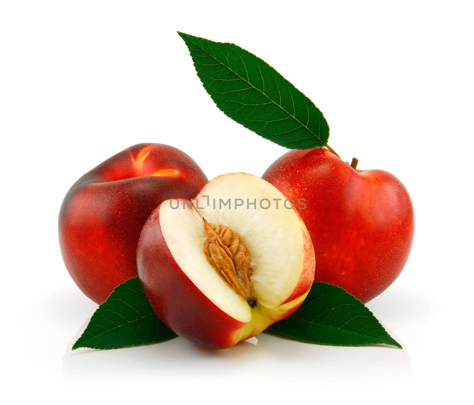 Ripe Sliced Peach (Nectarine) with Green Leafs Isolated on White Background