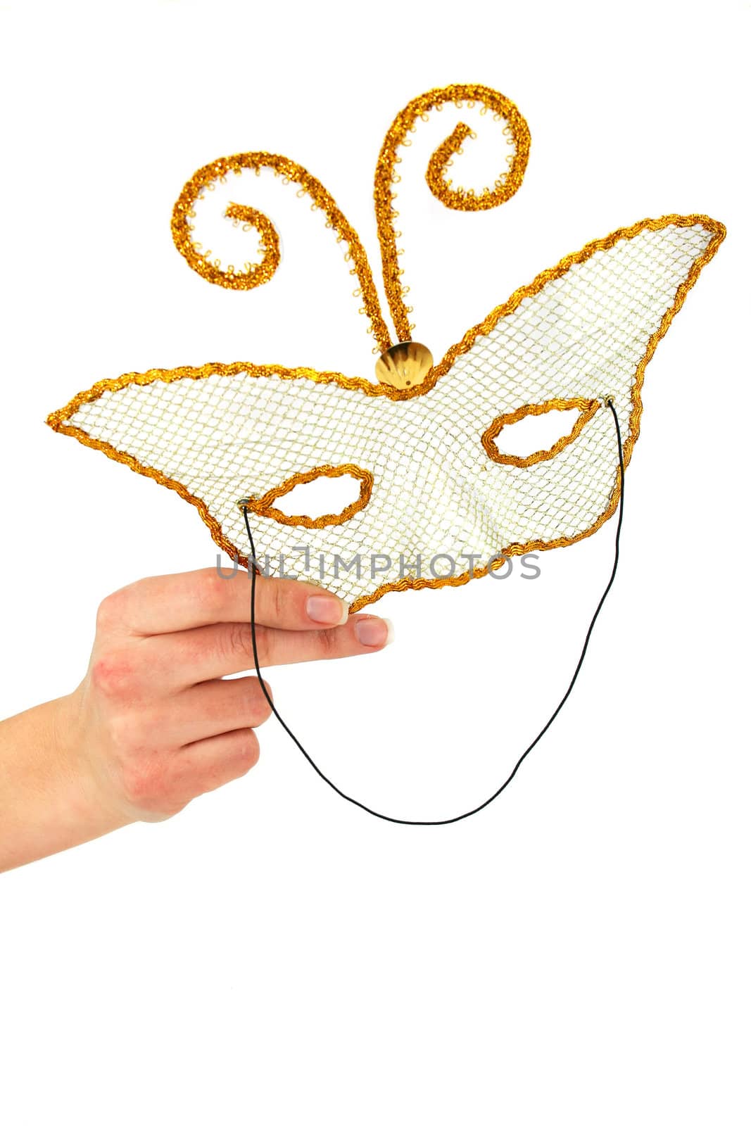 Female hand holding masquerad mask isolated on a white background