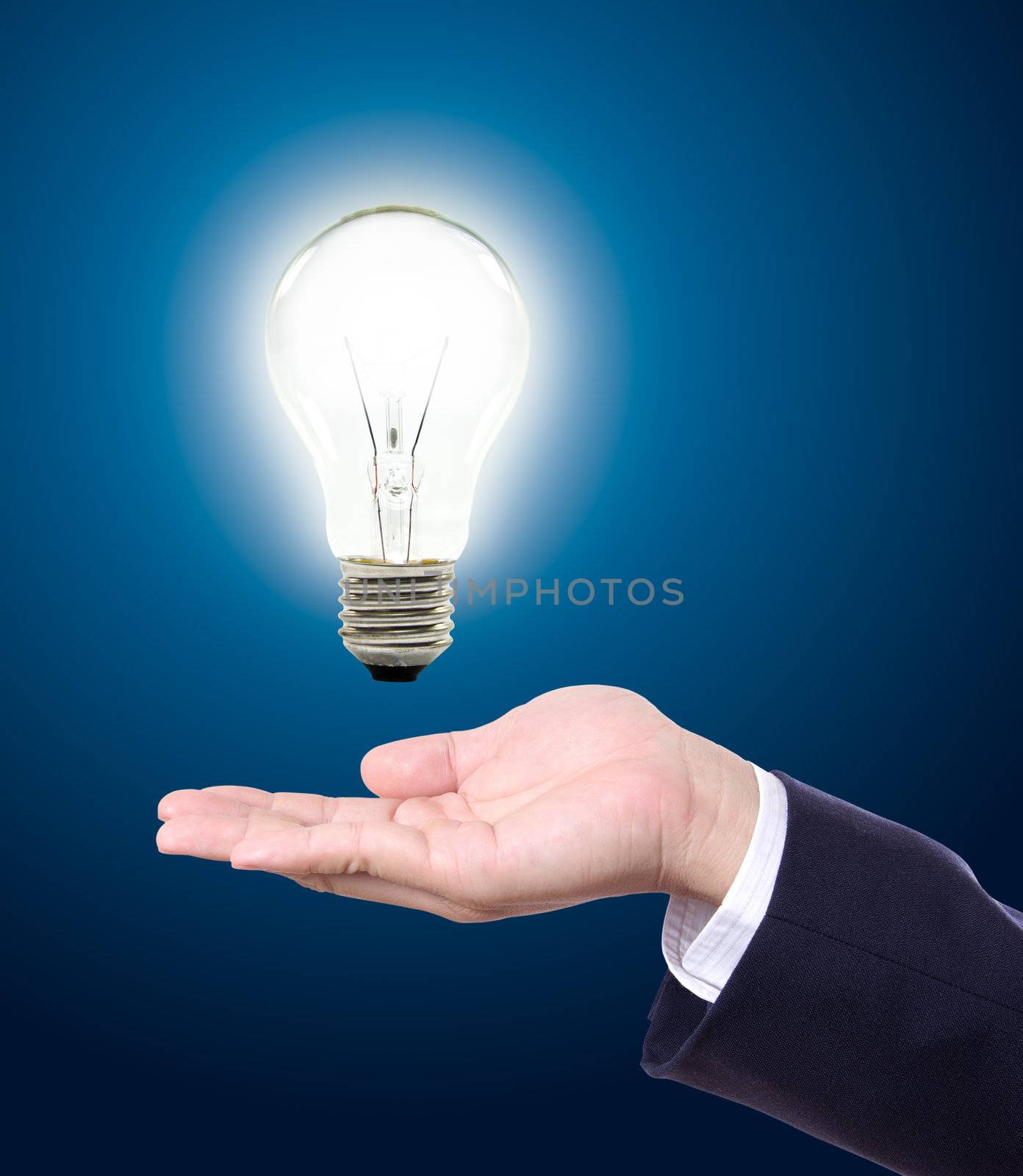 light bulb in hand by tungphoto