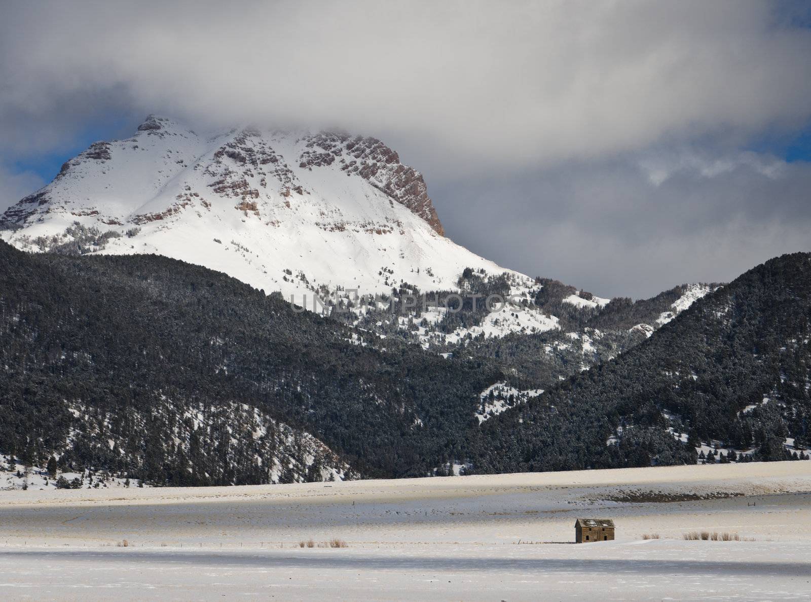 Sphinx Mountain and ranch land in winter, Madison County, Montana, USA