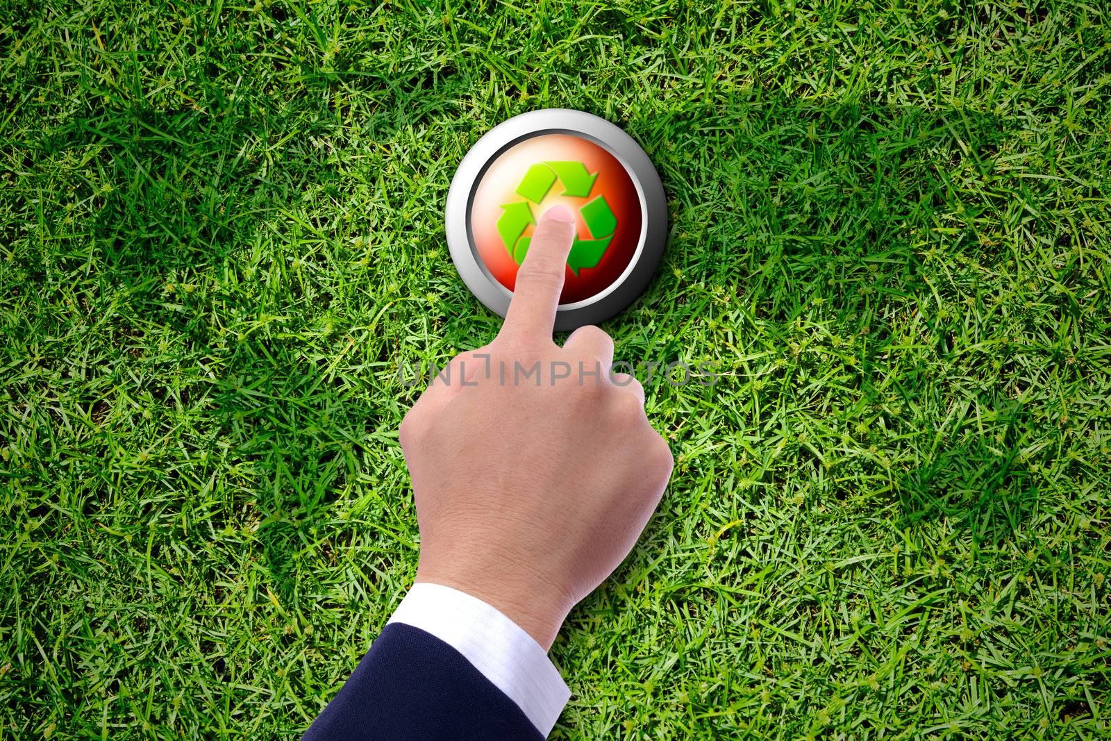 business man hand pushing recycle button by tungphoto