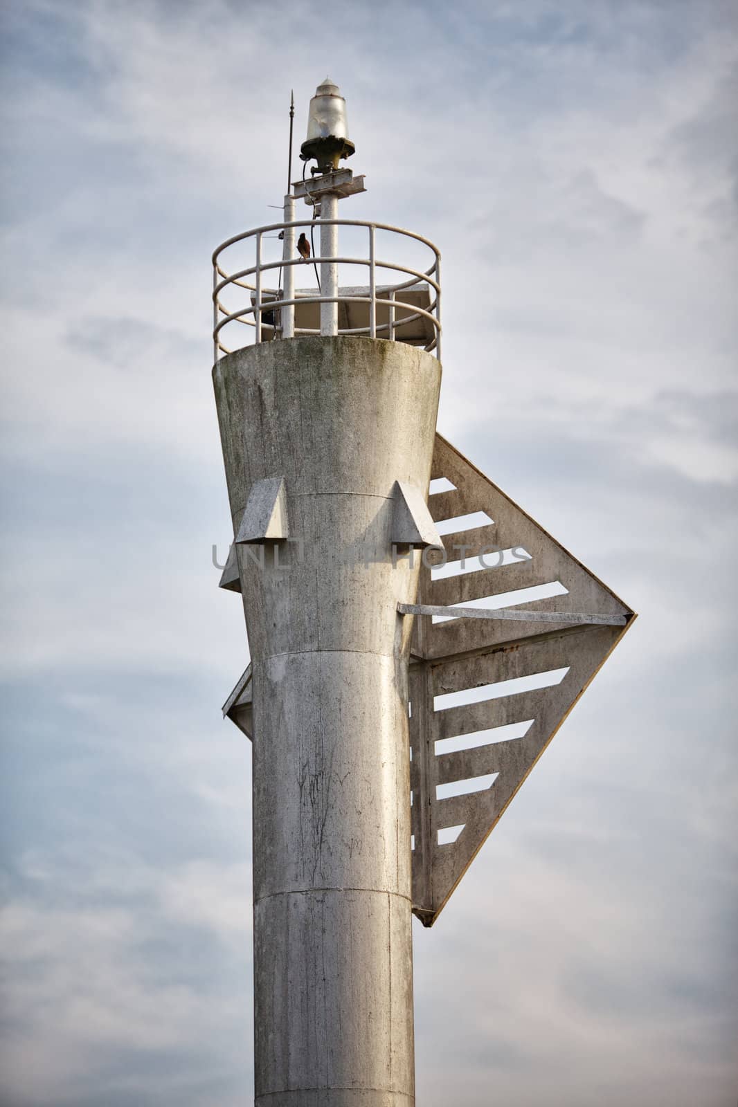 upper part of gray modern metal lighthouse