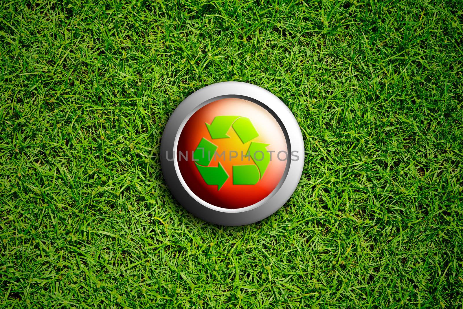 recycle button on green grass texture