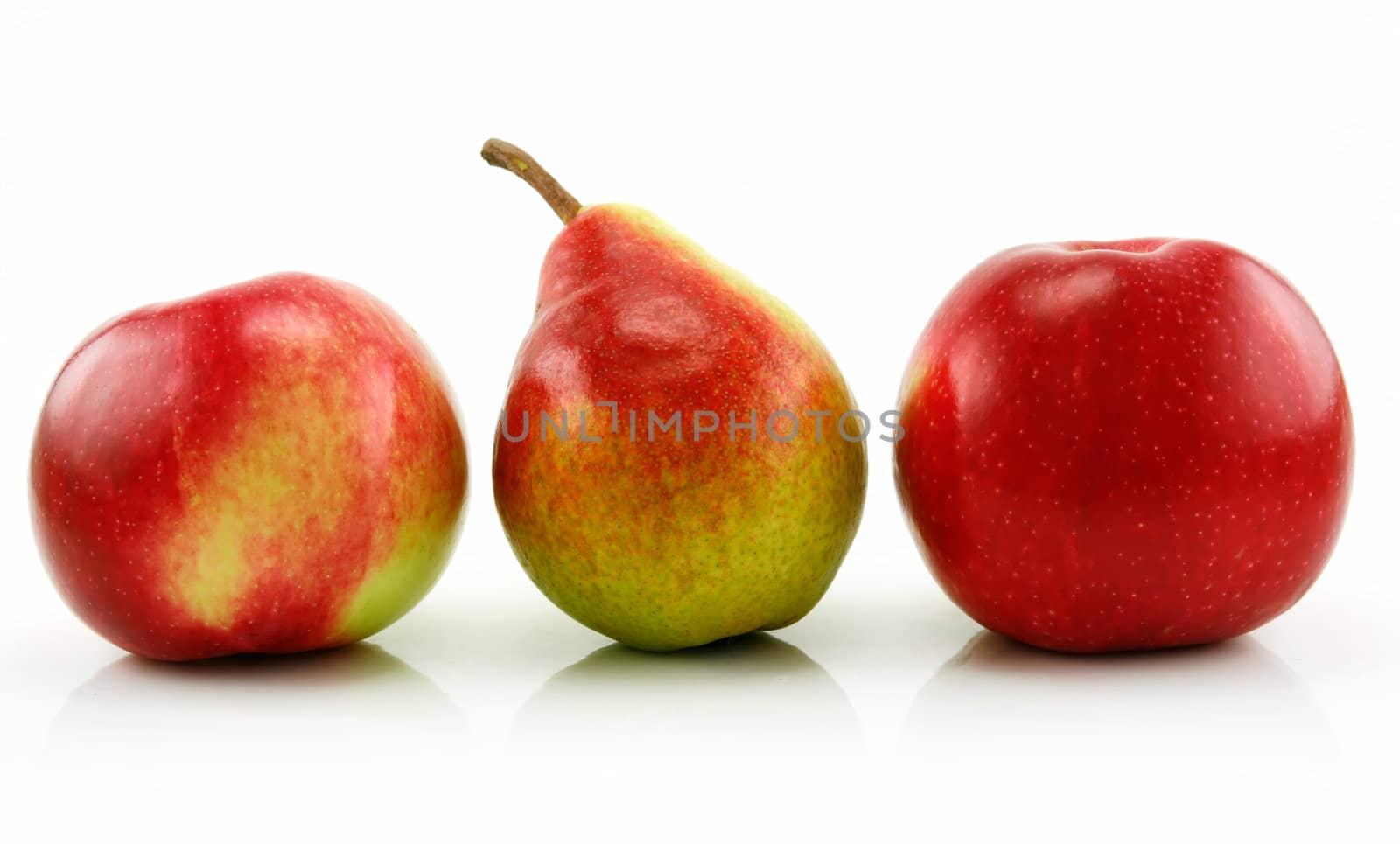 Ripe Apples and Pear in a Row Isolated on White Background