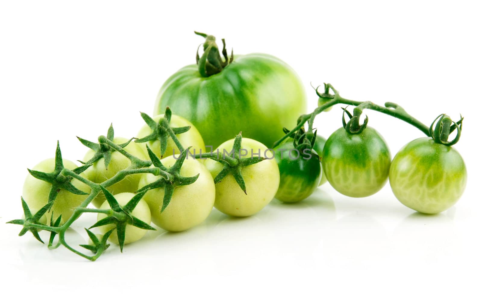 Bunch of Ripe Yellow and Green Tomatoes with Green Leaf Isolated on White Background