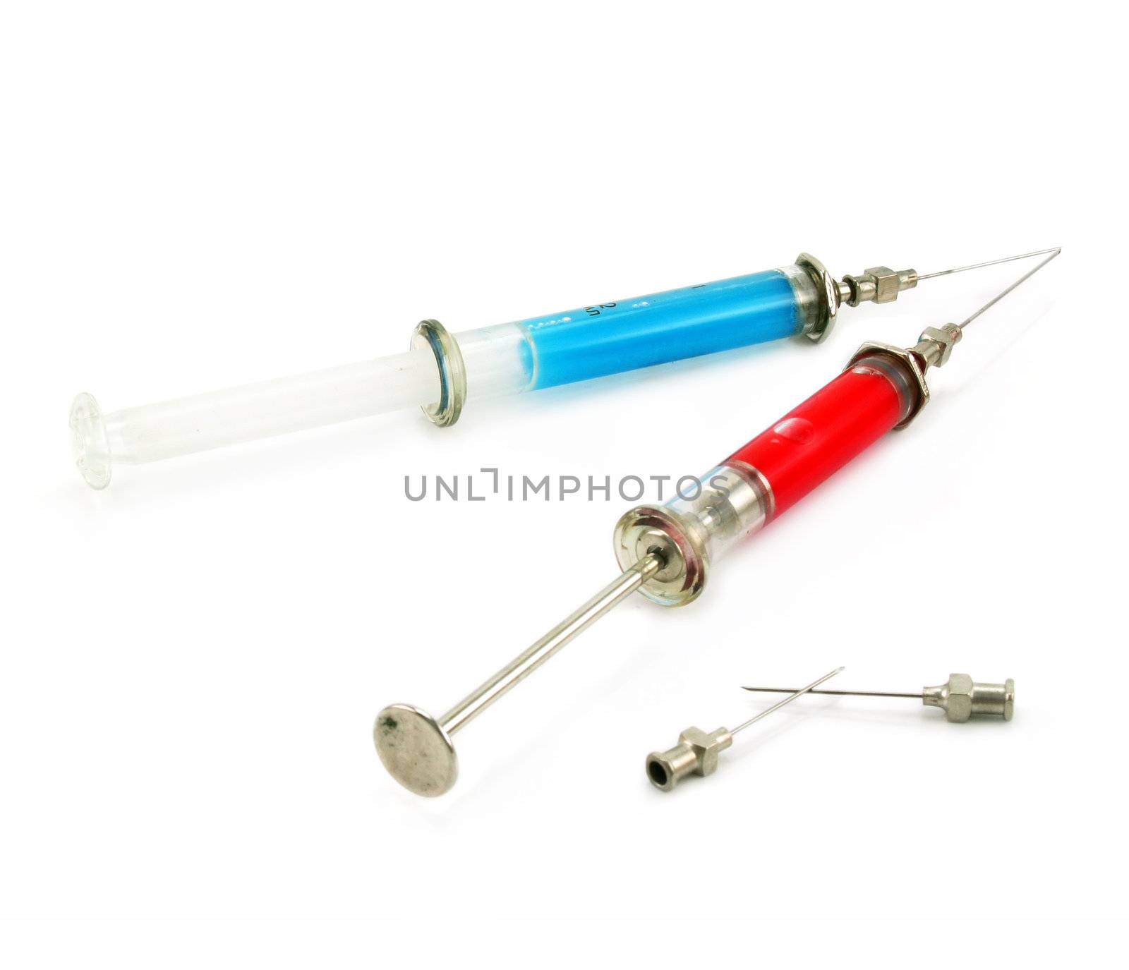 Two syringes with acid substance isolated on a white background