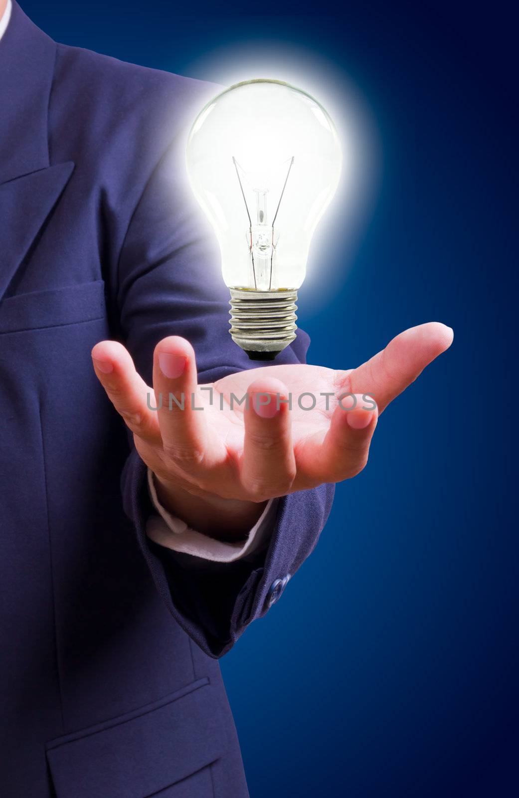 light bulb on hand by tungphoto