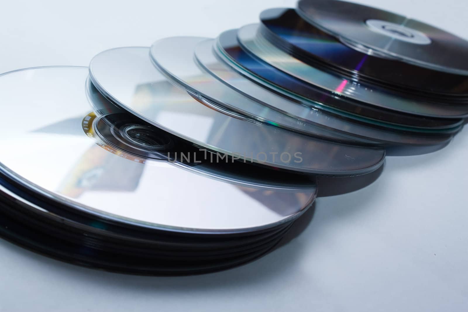 Heap of CD on white background. by nigerfoxy