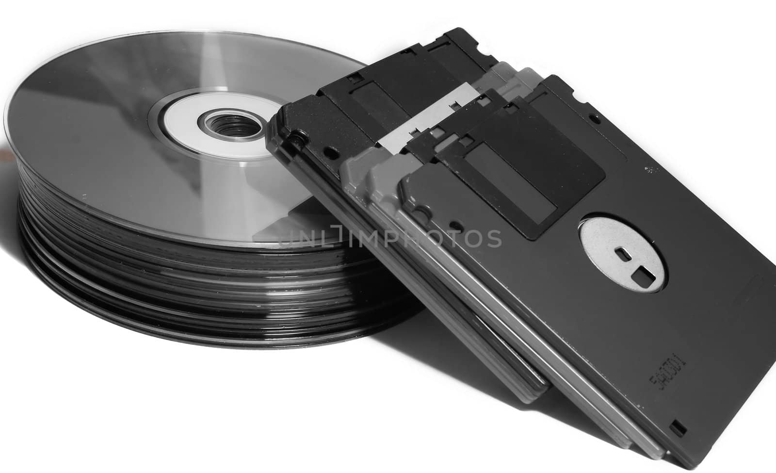 CD with diskettes on white background.