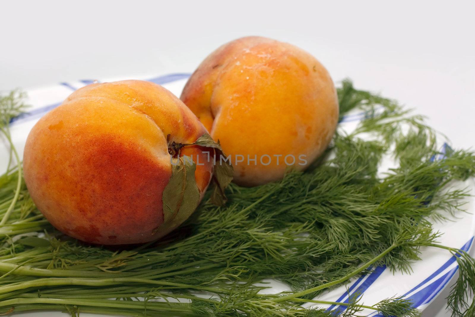 two peach on the plate
