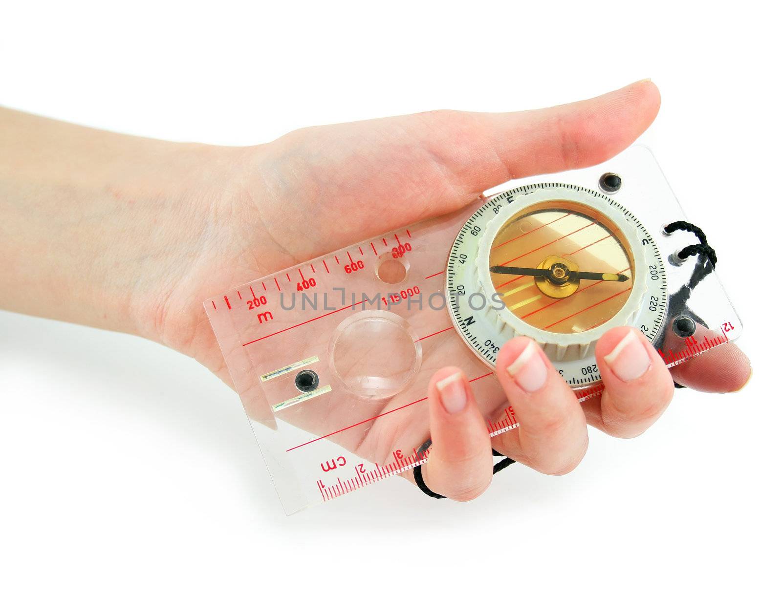 Female hand holds transparent liquid compass isolated